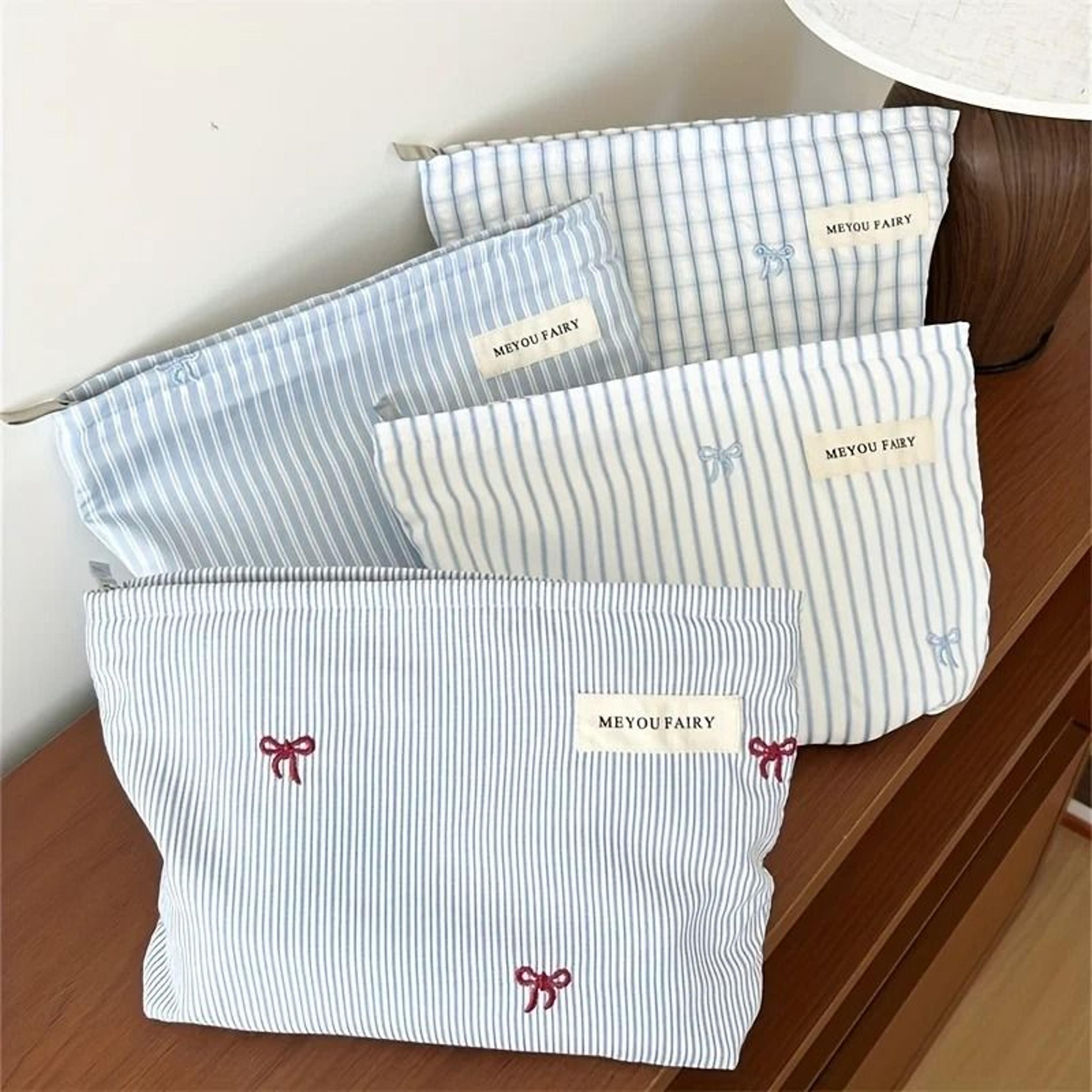 light blue striped bow travel makeup organizer bag