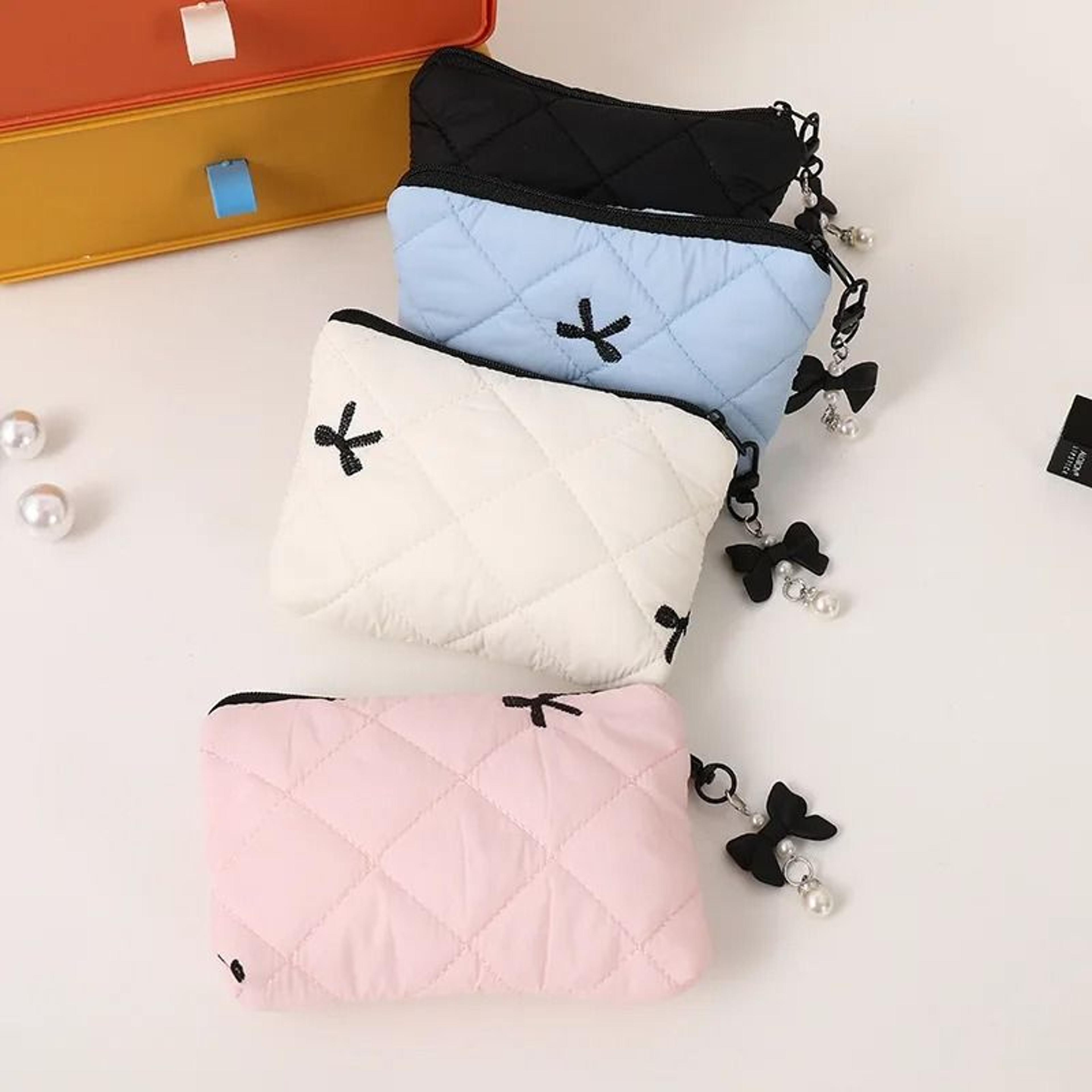 quilted bow makeup pouch and handheld travel clutch
