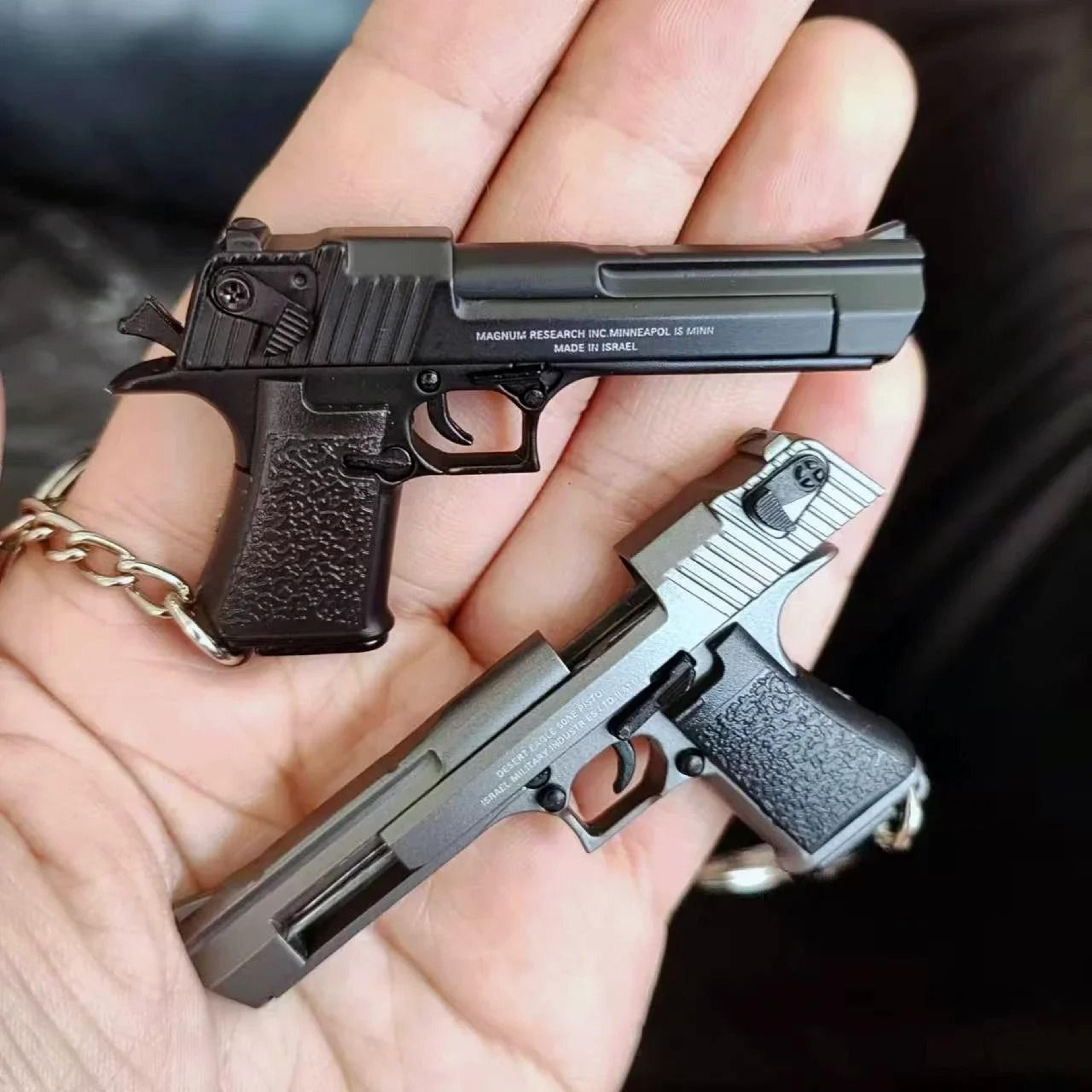 desertedge alloy pistol keychain with miniature collector model detail