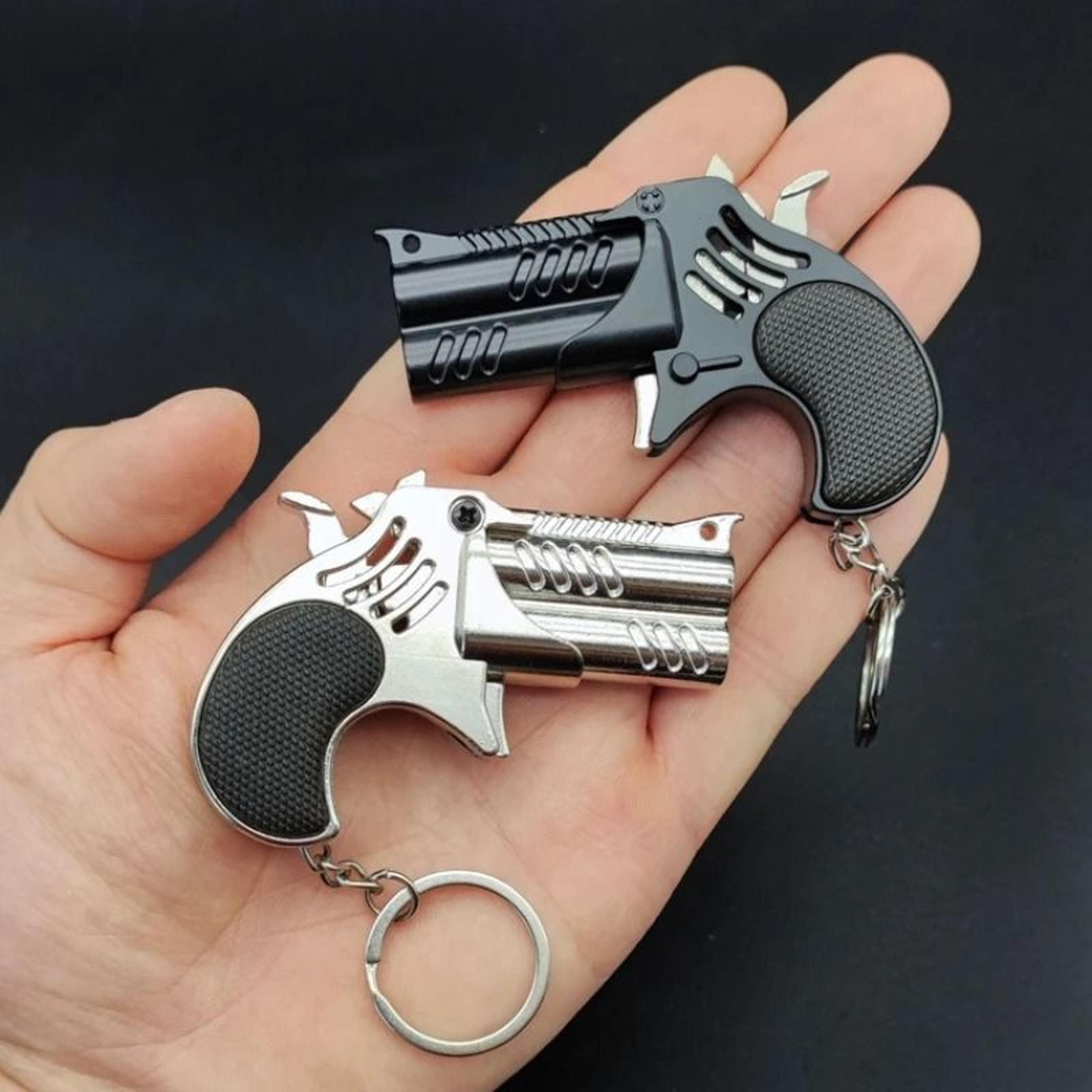 pocketstrike mini rubber band gun and metal keychain toy