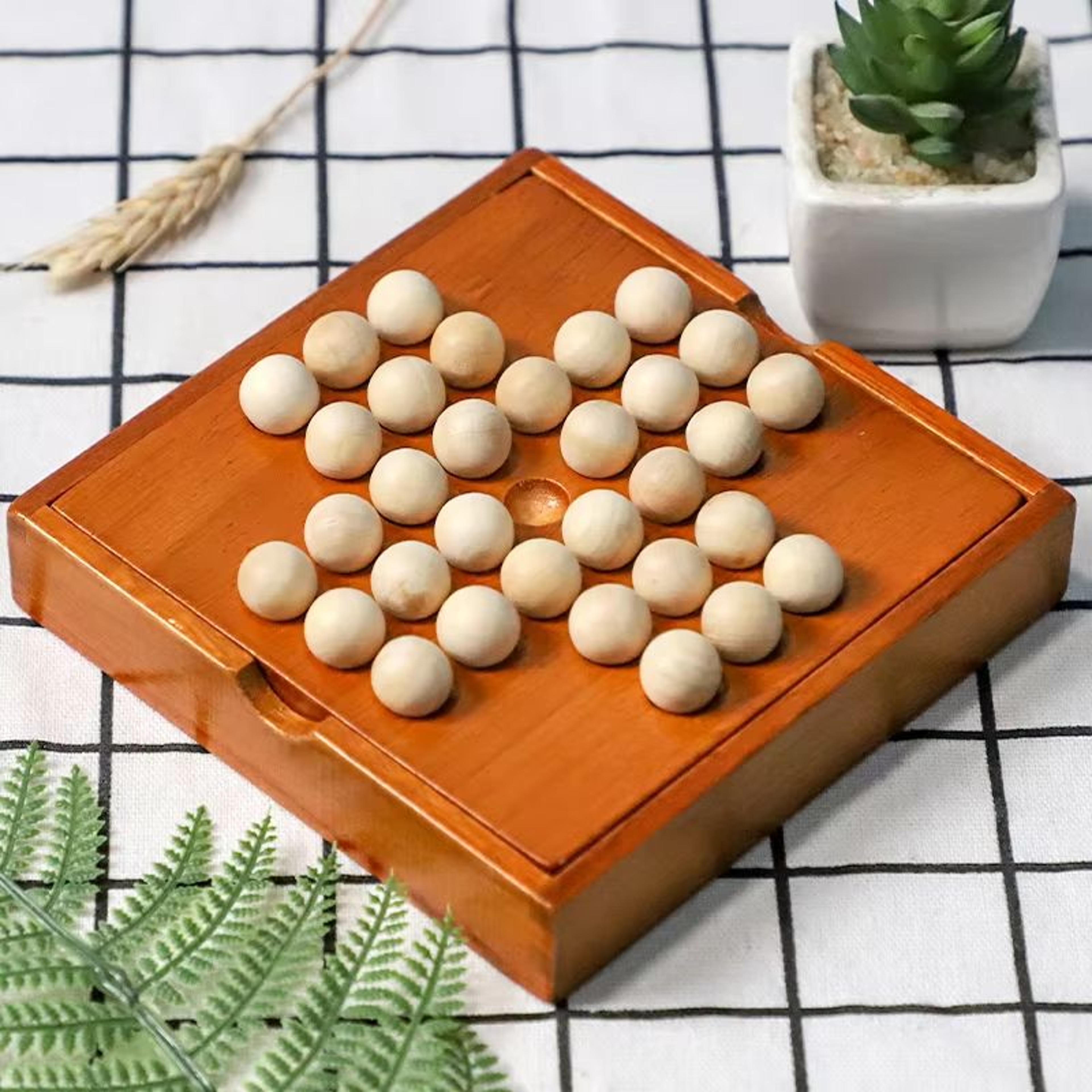 wooden peg solitaire board game, single-player diamond puzzle for focus & logic