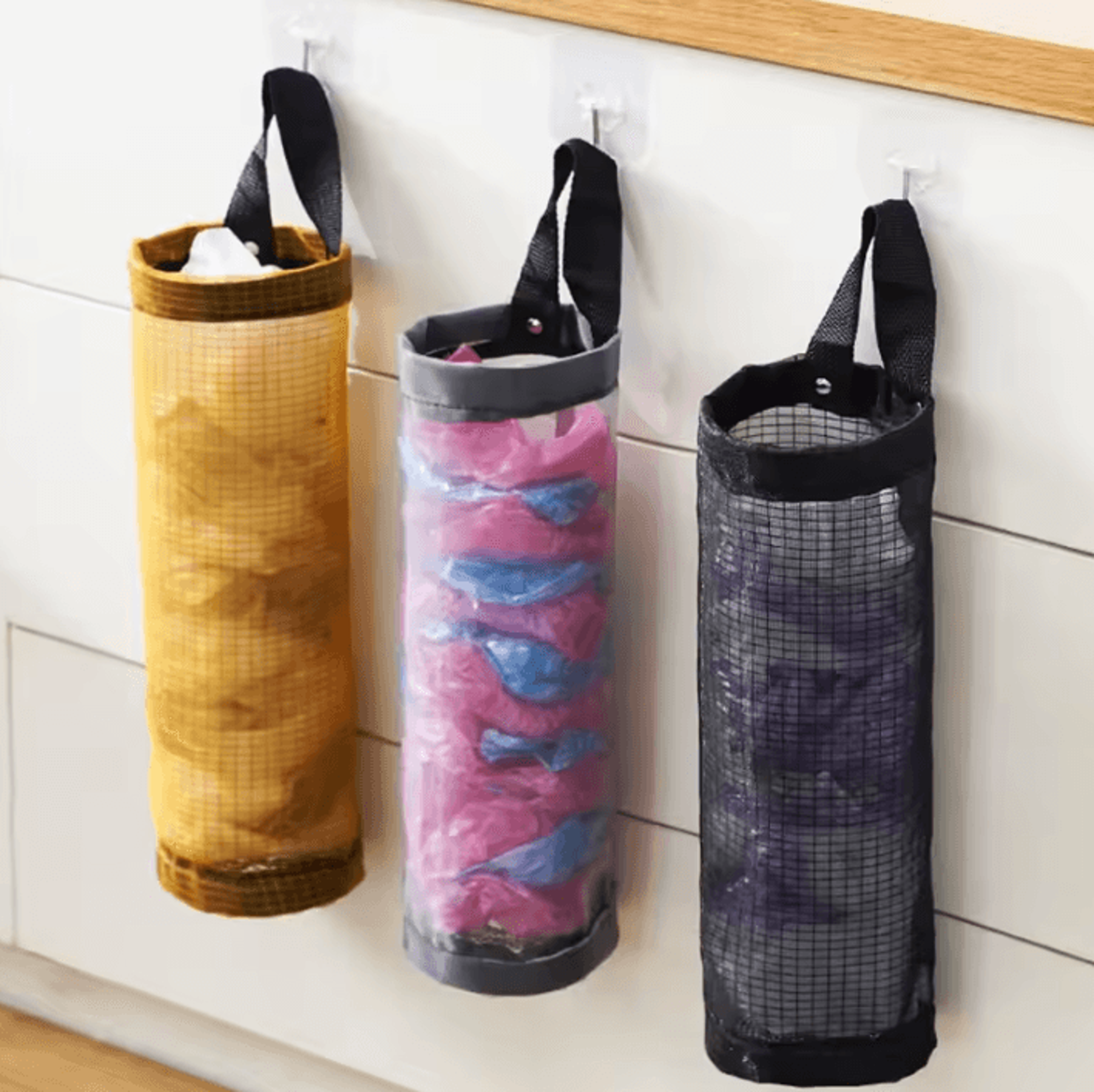 wall-mounted trash bag dispenser & storage pouch for kitchen organization
