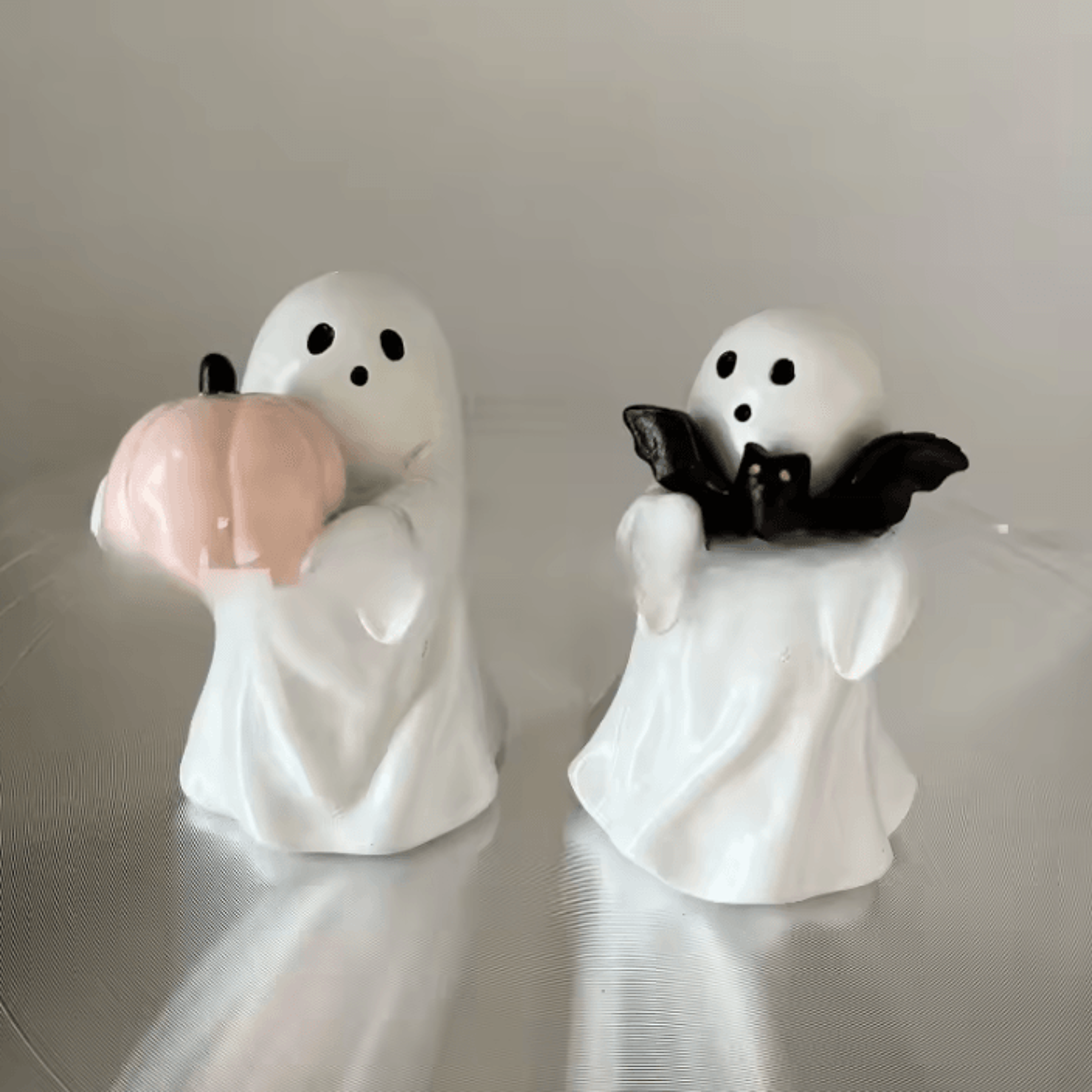 cute ghost holding pink pumpkin halloween figurine ceramic style decorative statue