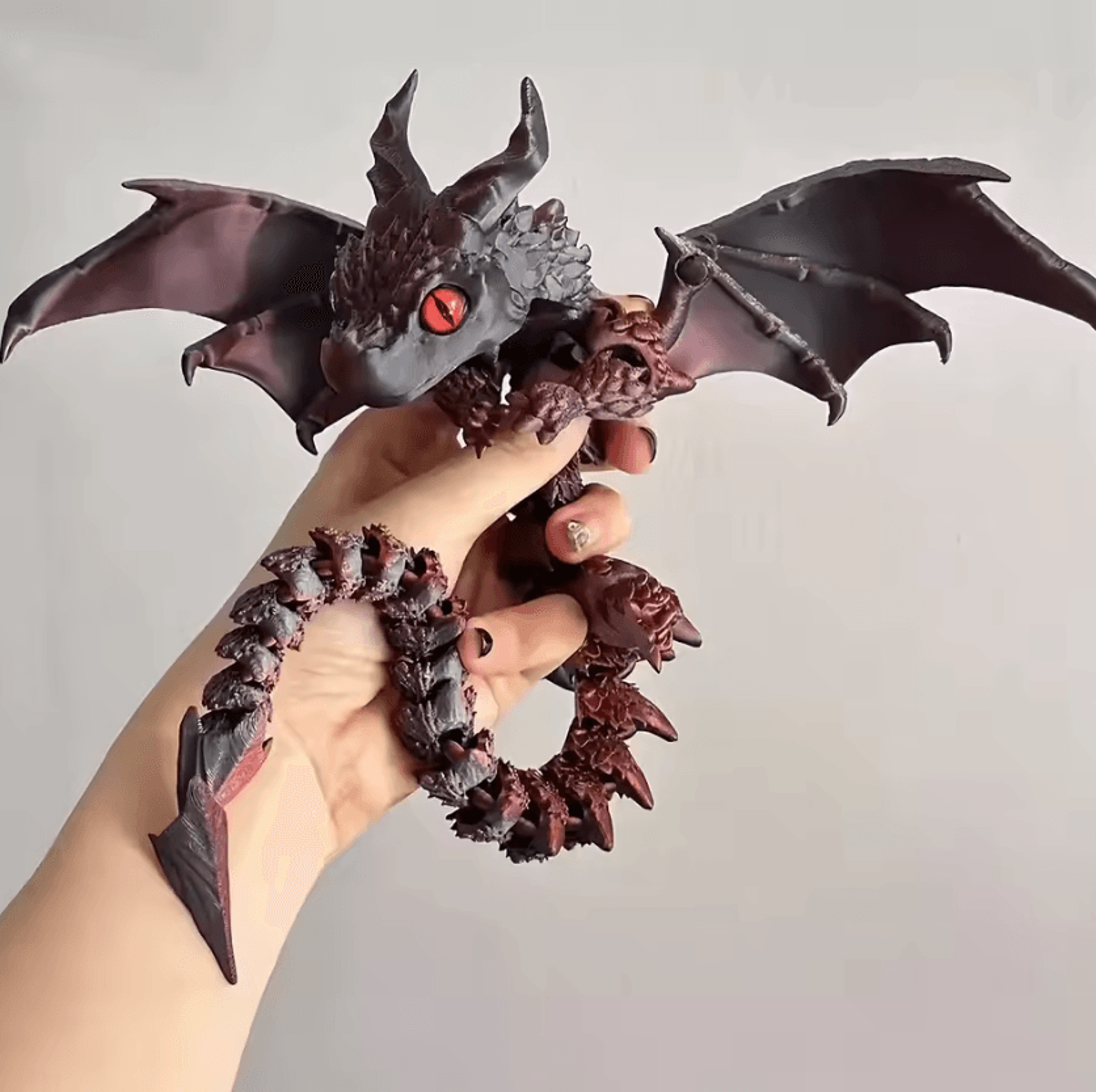 3d printed winged dragon figurine with adjustable wings and random eyes