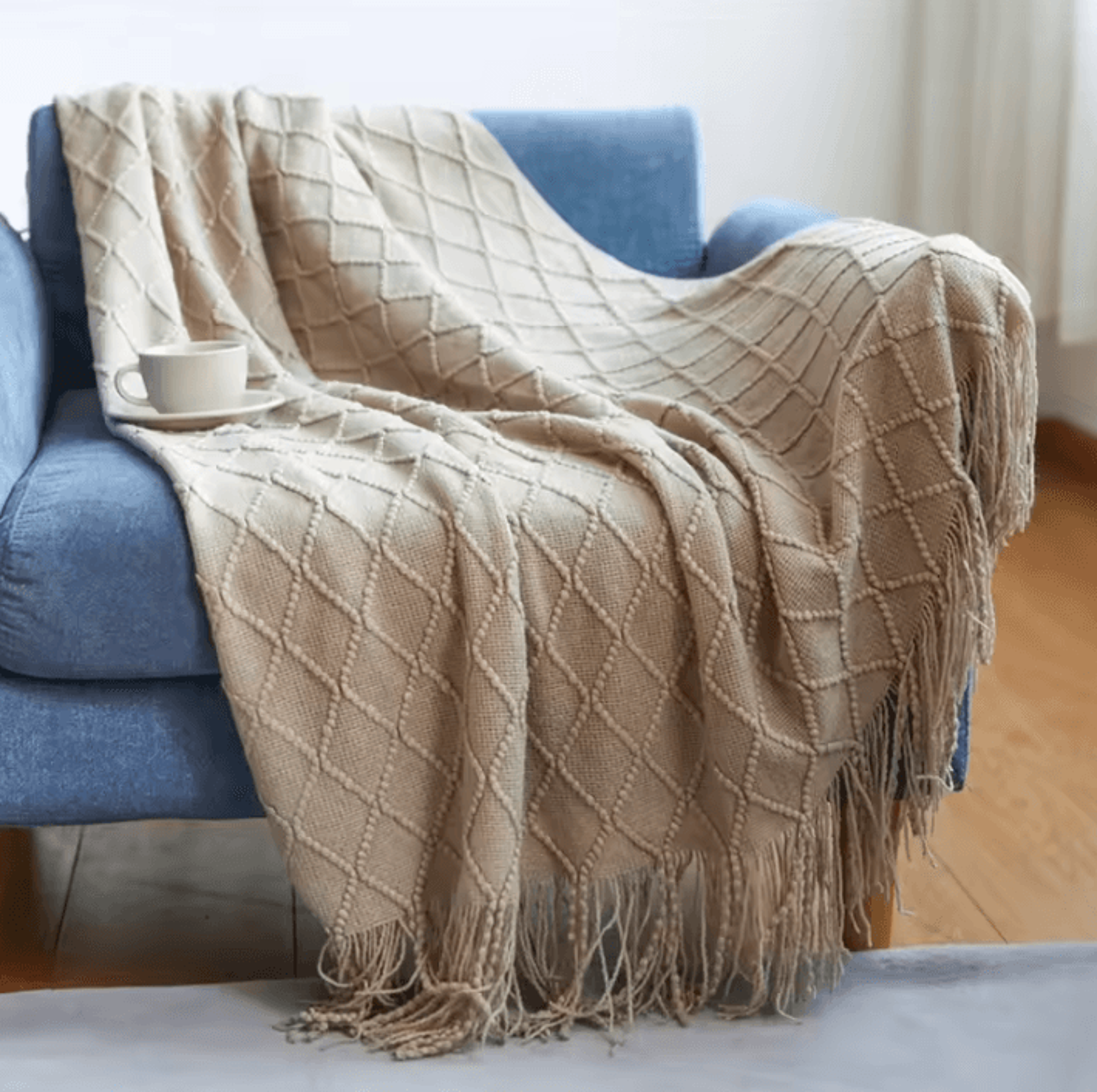 cream white textured knitted throw blanket with tassels