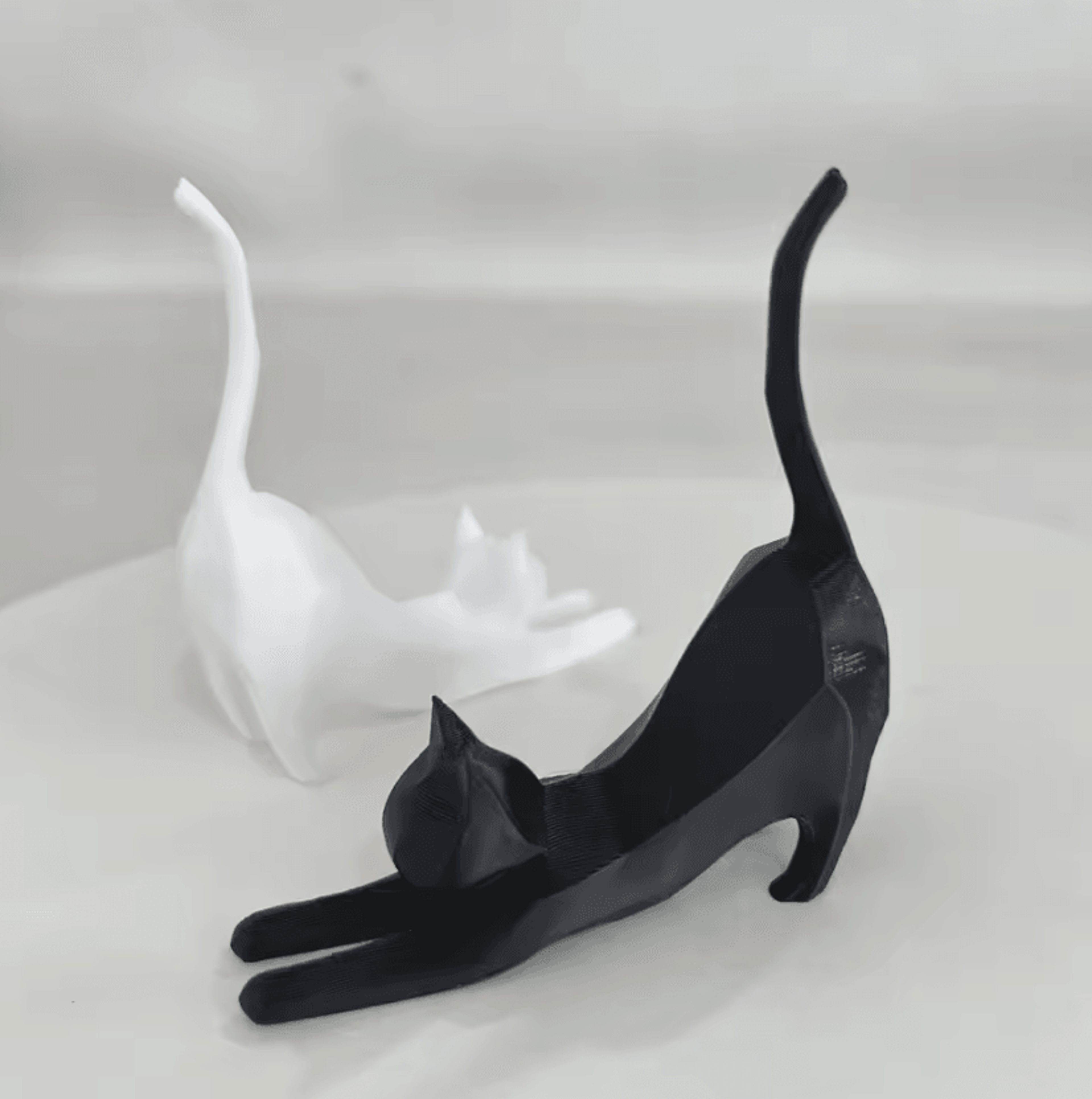 tiny stretching cat miniature sculpture