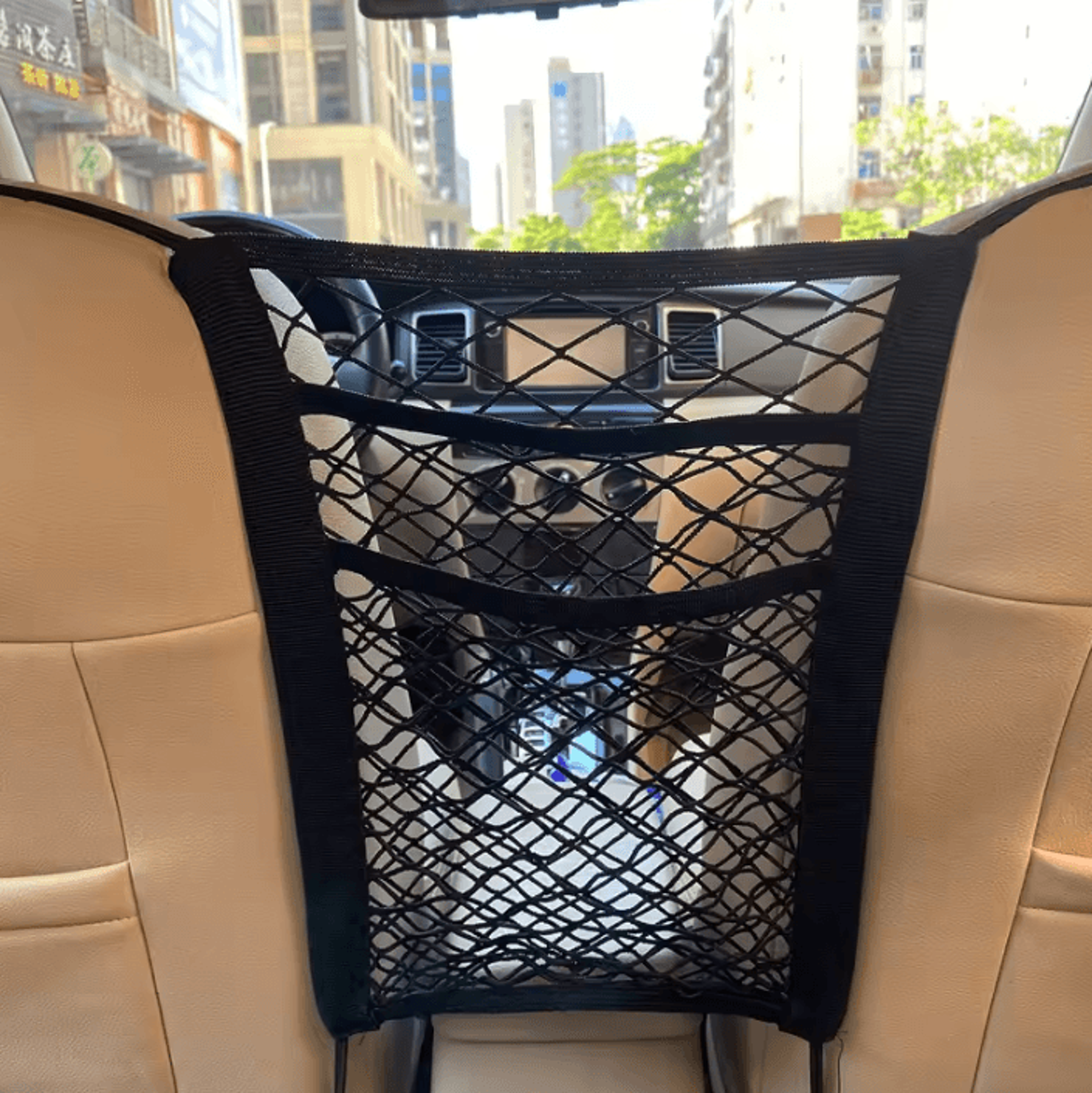 stretchable car seat storage net and pet barrier organizer