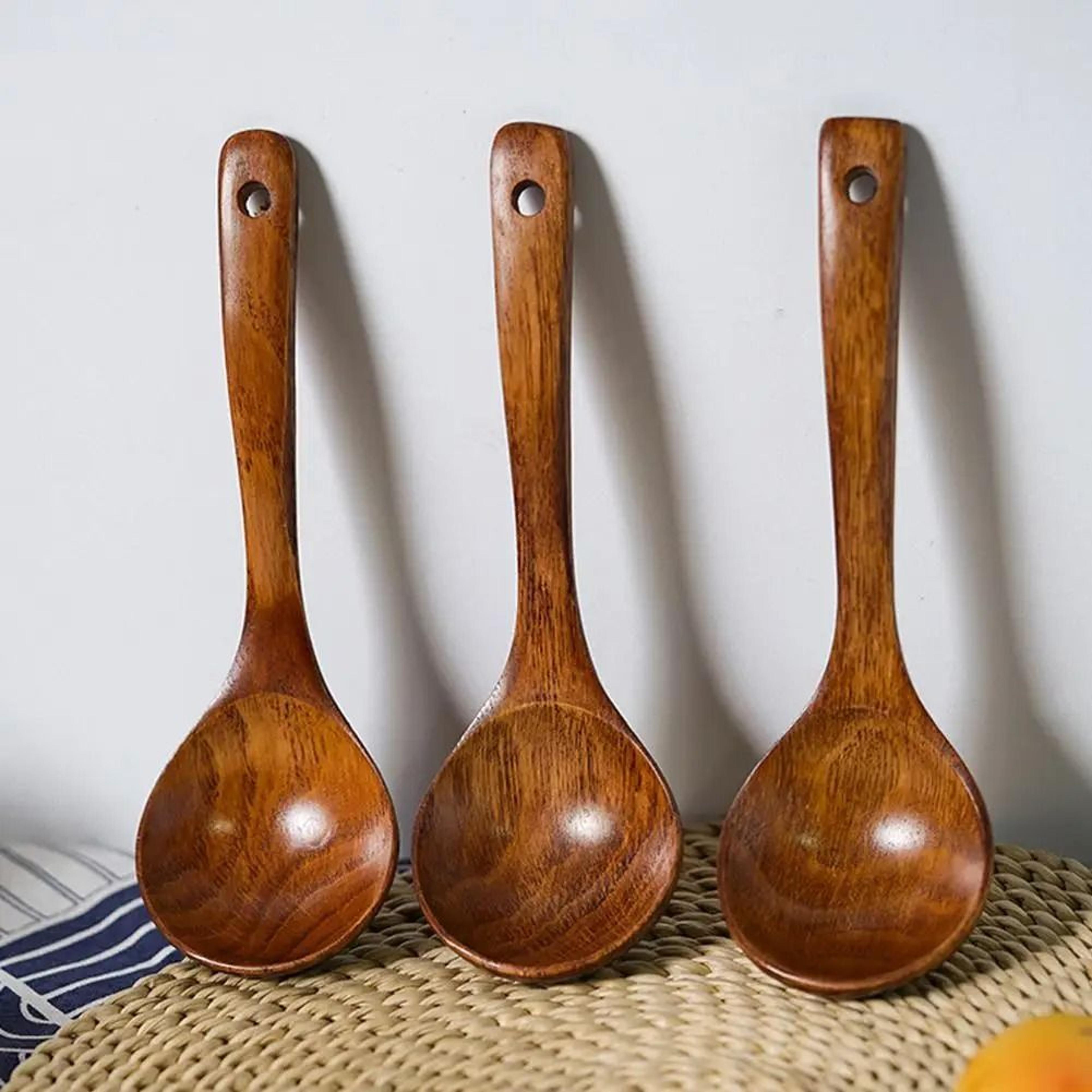 handcrafted long wooden cooking spoon