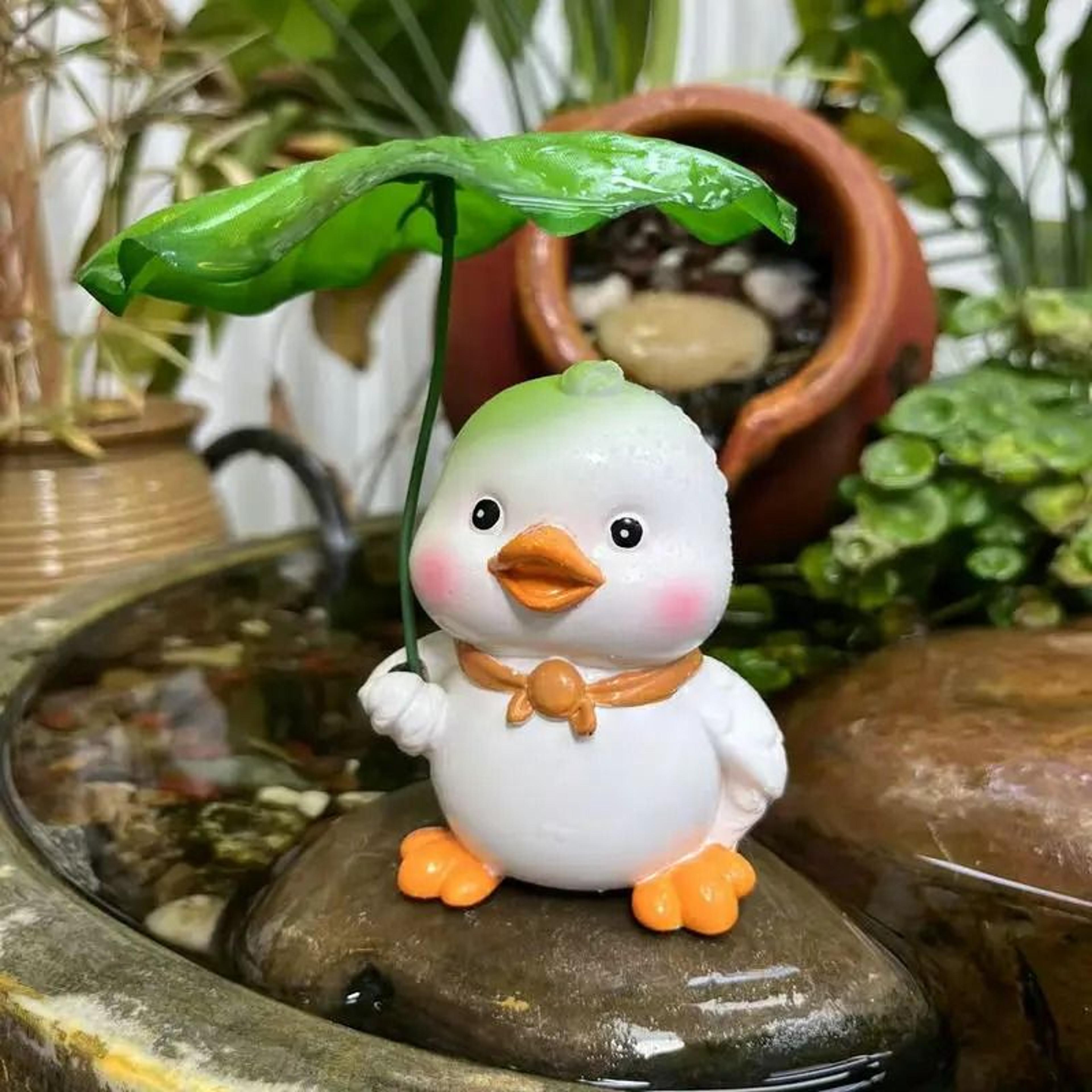 cute duck with leaf umbrella garden statue – whimsical resin figurine for patio, pond, and fairy gardens