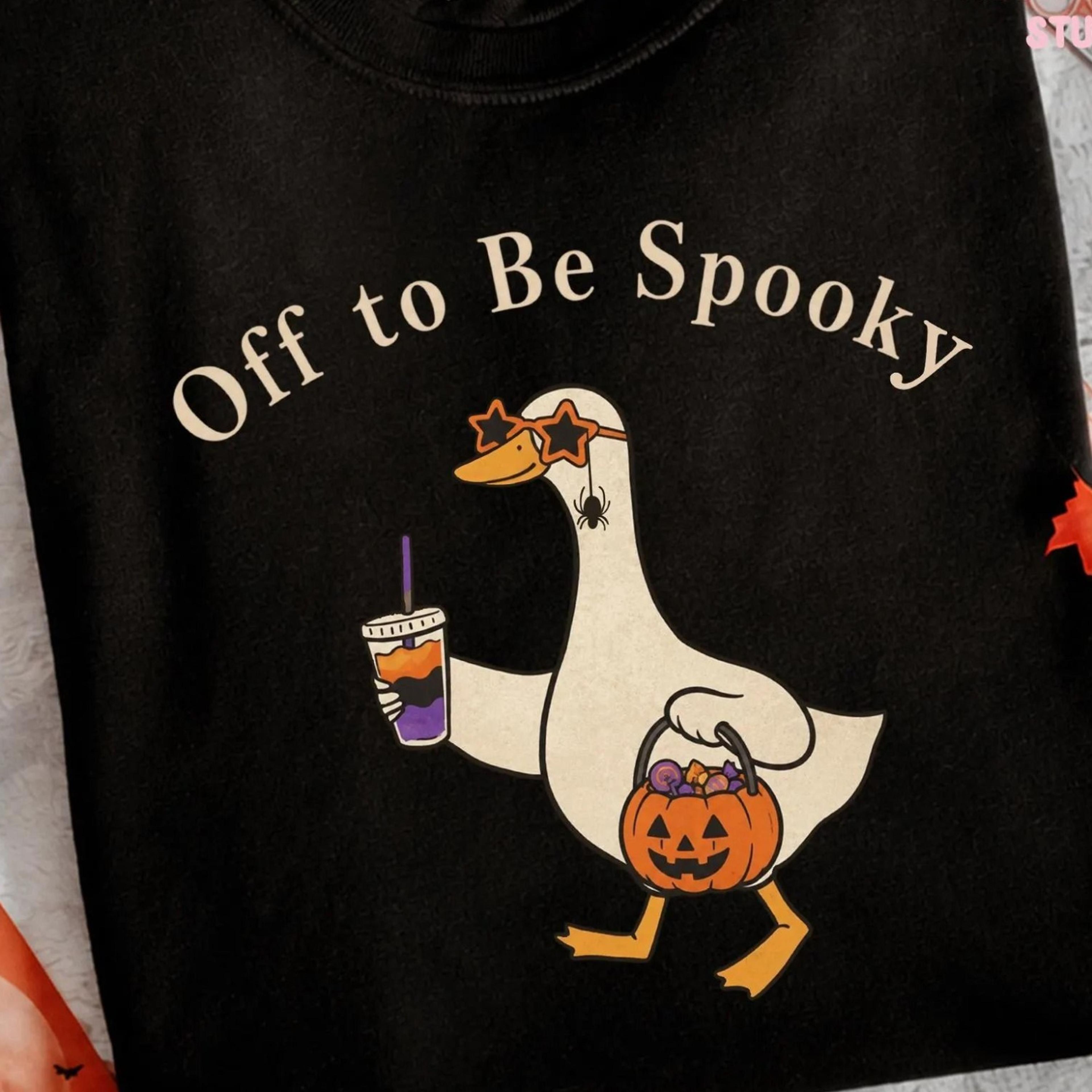 off to be spooky goose holding coffee pumpkin bucket unisex gildan t-shirt sweatshirt, funny halloween goose shirt, fall