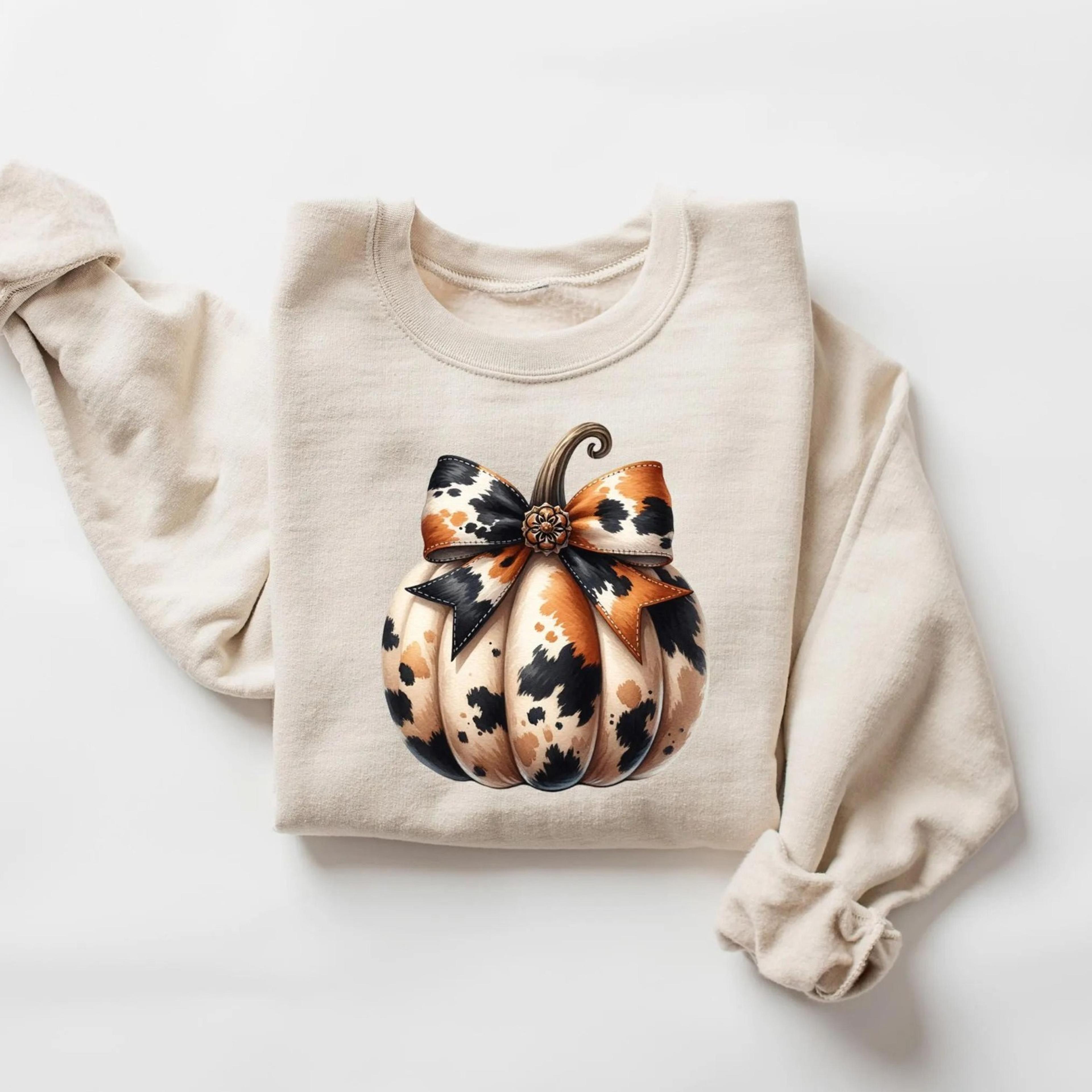 cowhide bow pumpkin sweatshirt, pumpkin coquette hoodie, thanksgiving pumpkin shirt, pumpkin season apparel, autumn gift