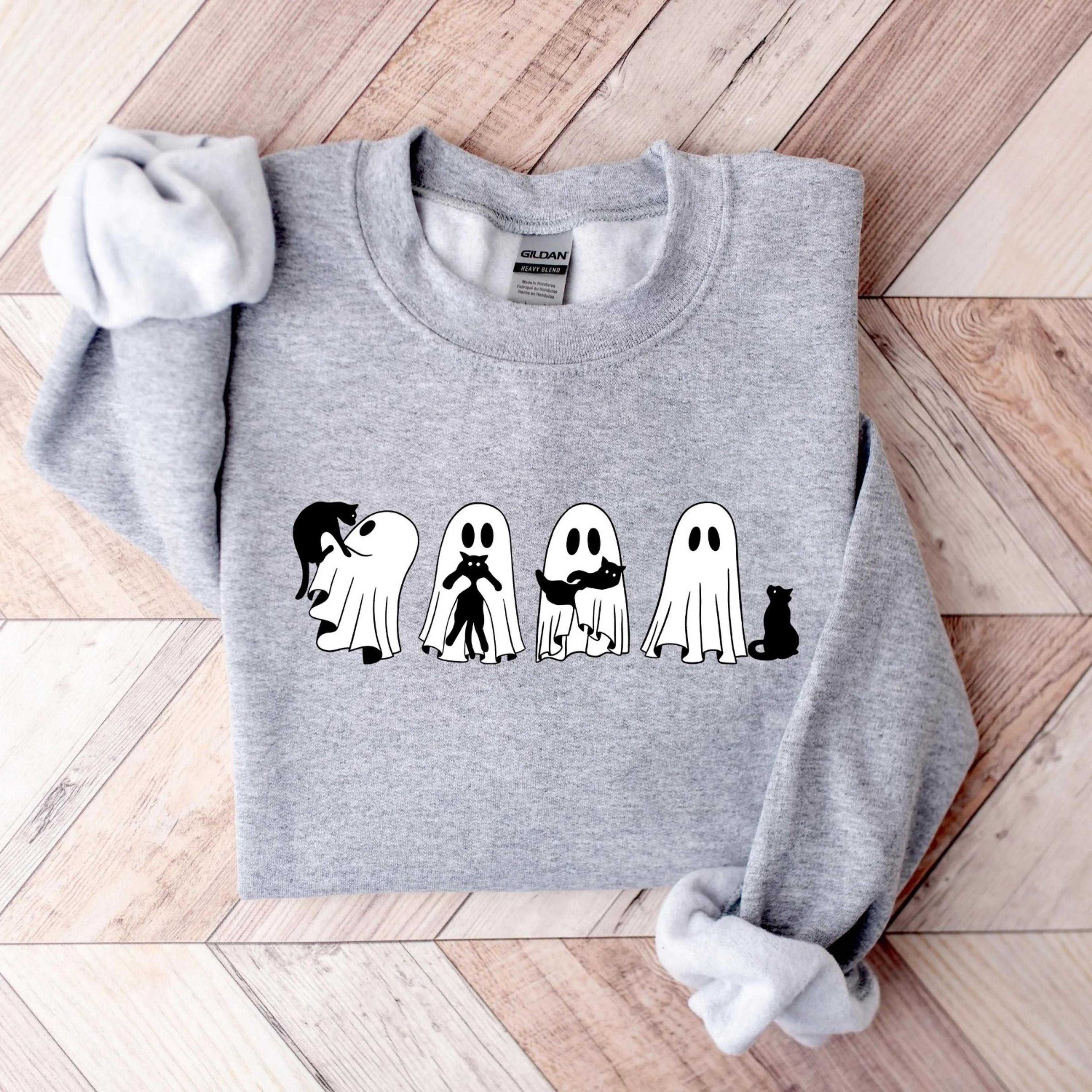 ghost holding black cat sweatshirt ghost cat halloween hoodie, halloween gift for cat owners, halloween cat tee, black