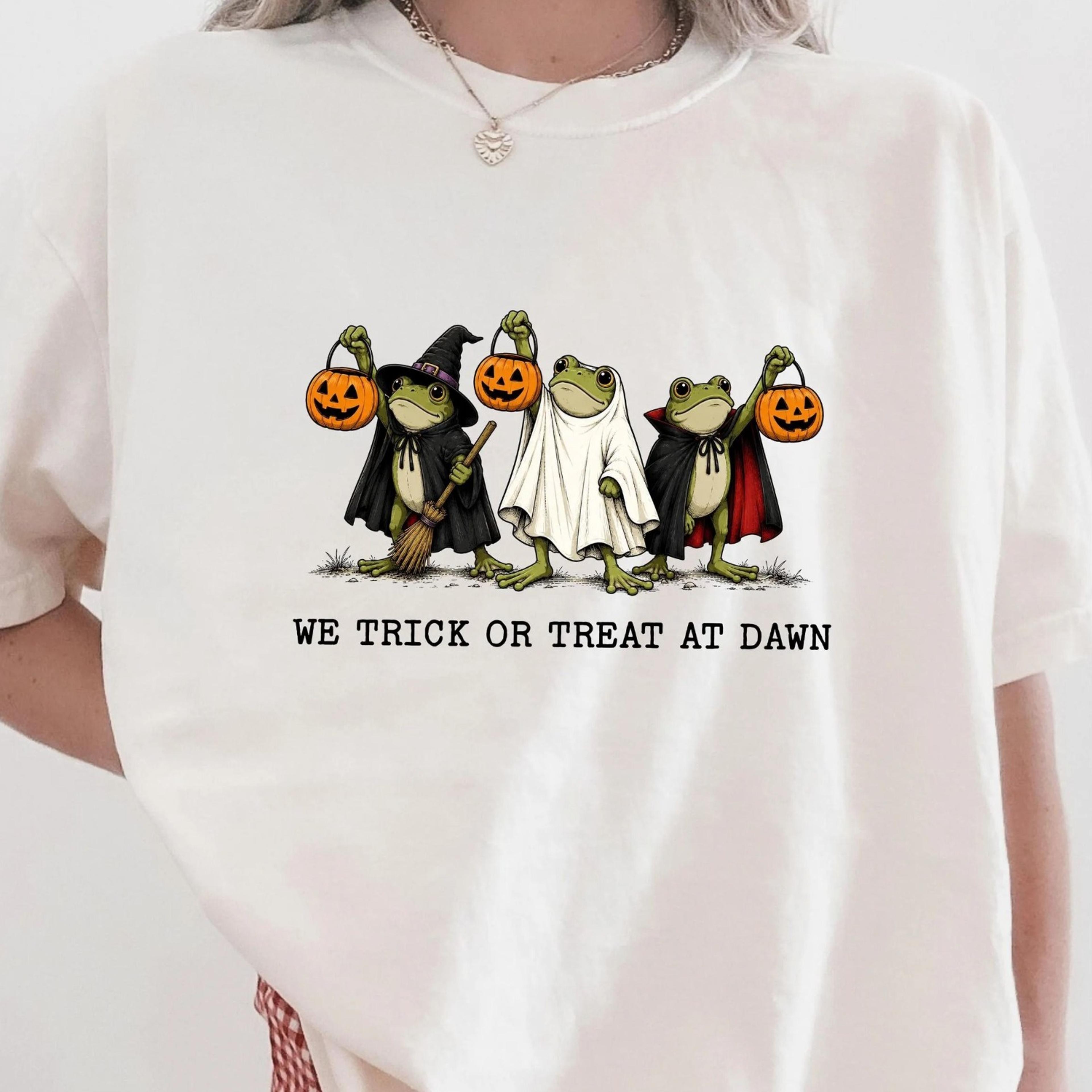 we trick or treat at dawn shirt, halloween frog shirt, frog halloween tee, cute ghost frog shirt, spooky season tee,