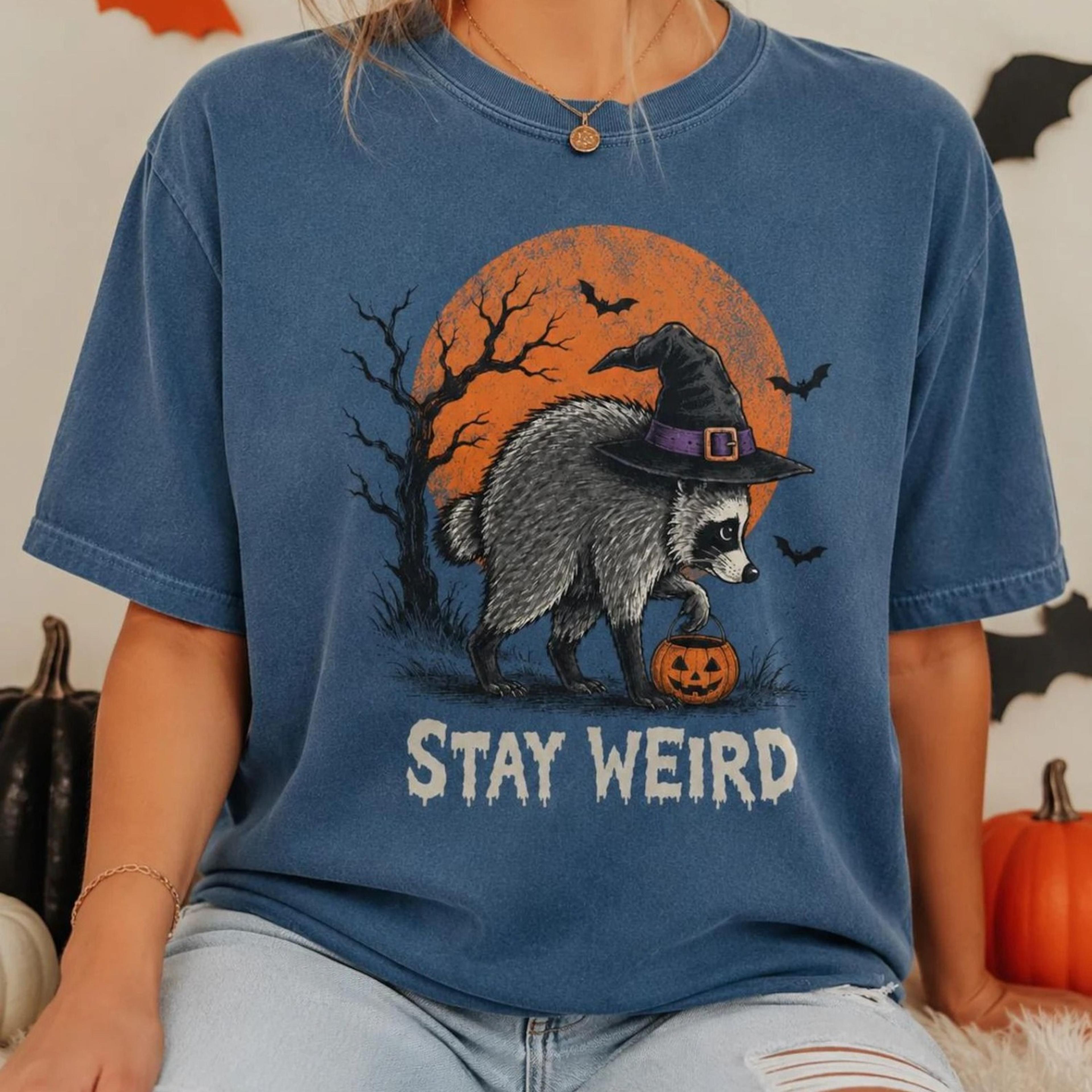 stay weird funny raccoon halloween shirt, viral raccoon meme tee, witch raccoon graphic, spooky pumpkin fall shirt