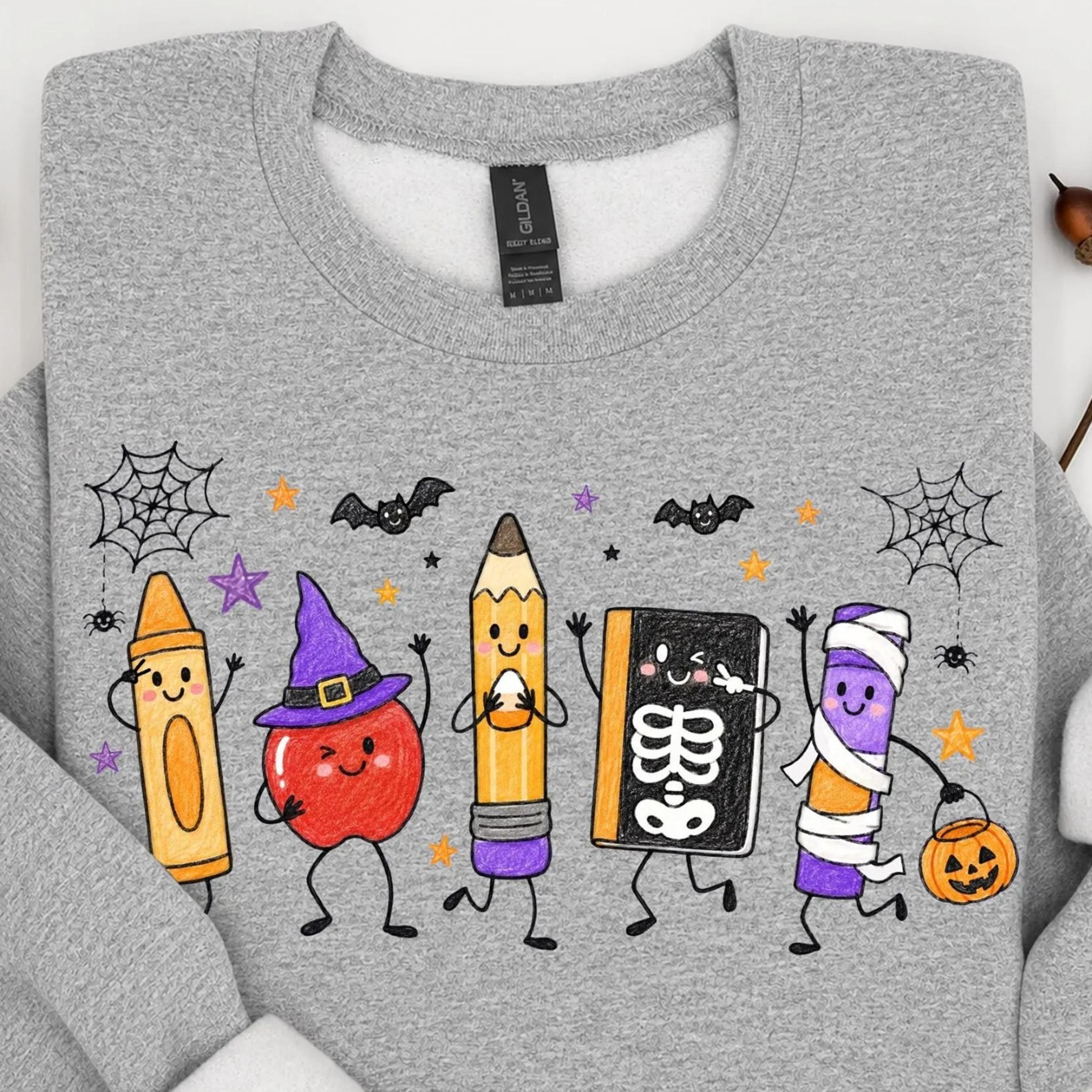 cute halloween teacher doodles shirt, crayon apple pencil book mummy crayon tee, spooky teacher shirt, back to school ha