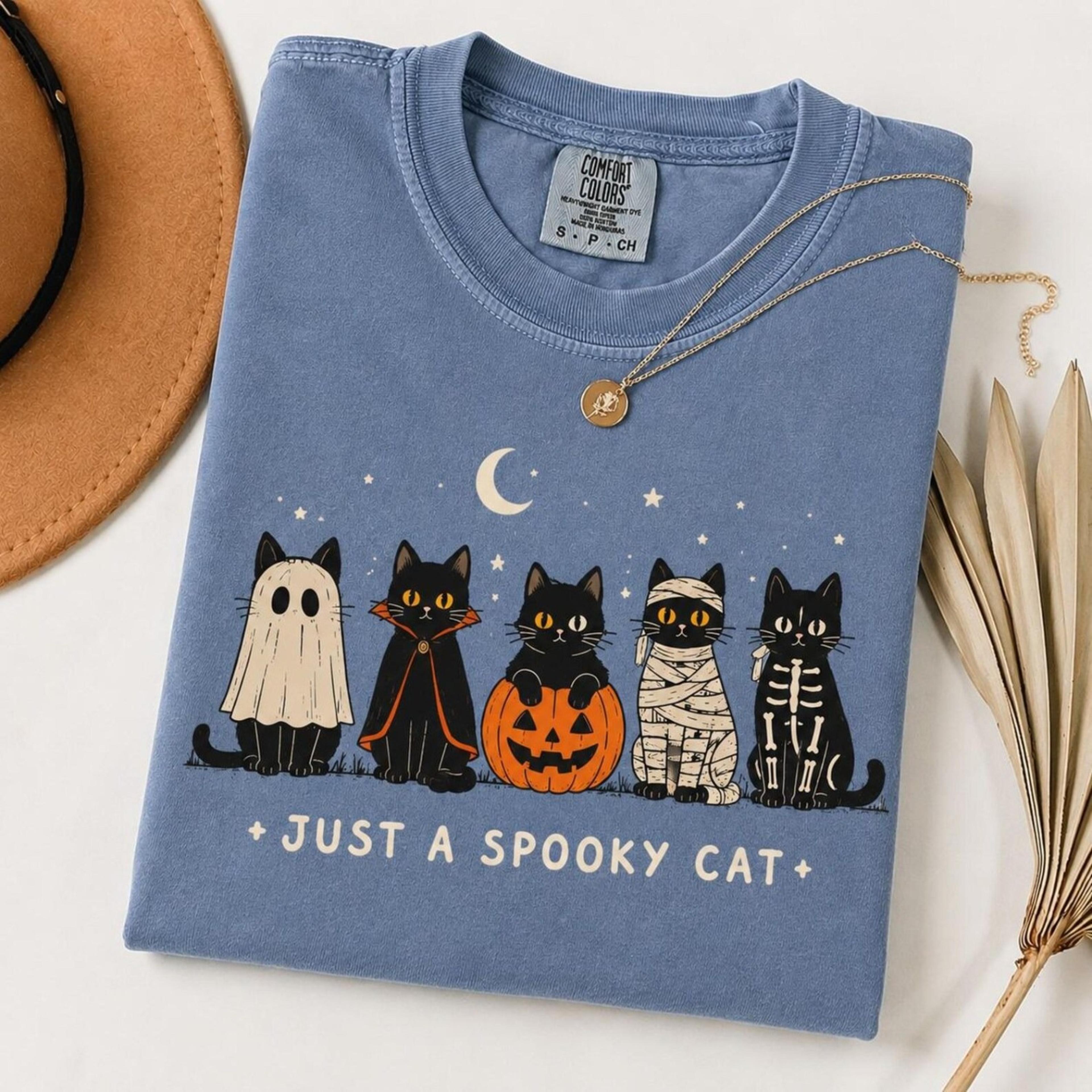 spooky cat halloween shirt, black cat halloween tee, cute witchy cat shirt, vintage halloween graphic tee, cat lover gif