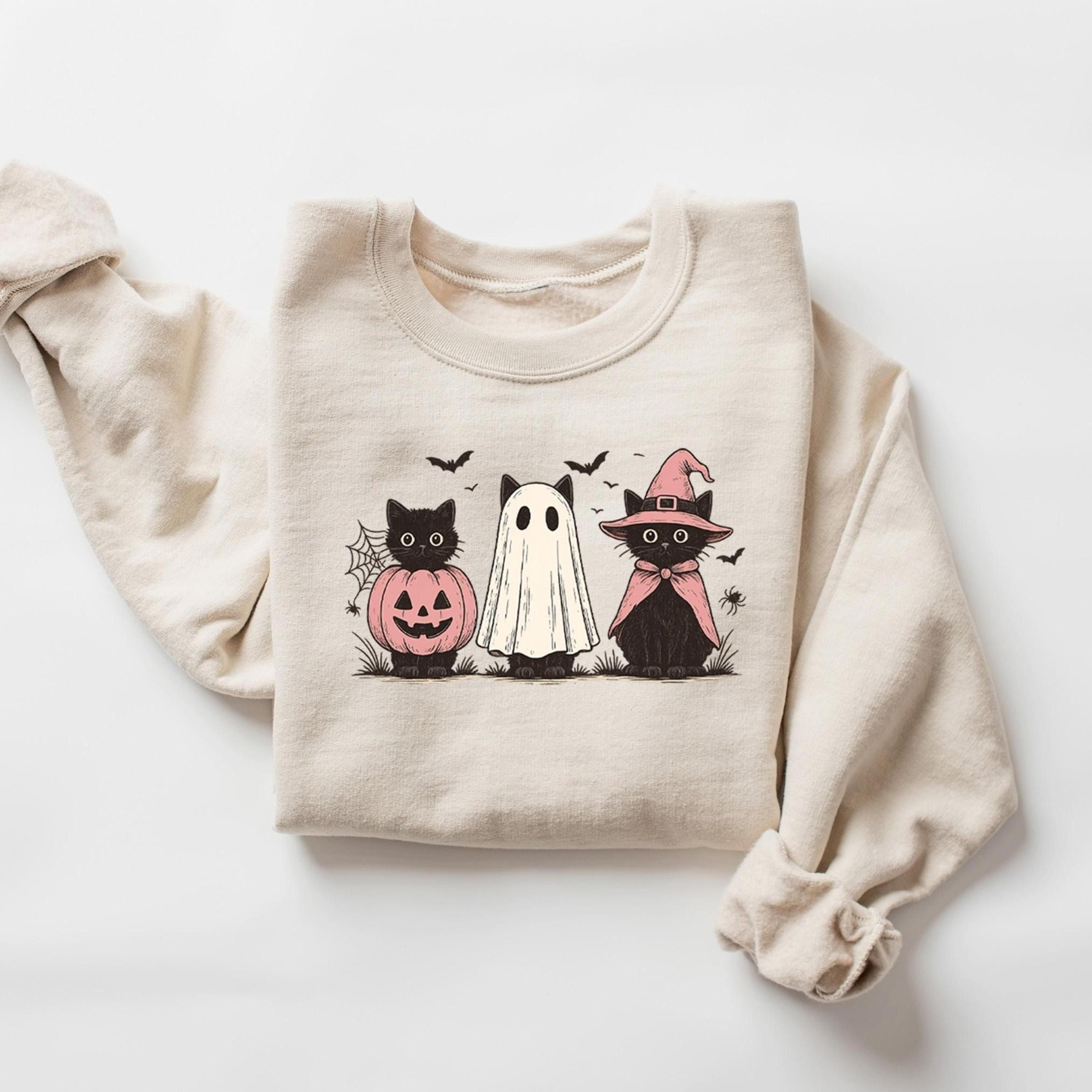 ghost holding black cat sweatshirt, ghost cat halloween hoodie, halloween gift for cat owners, halloween cat tee