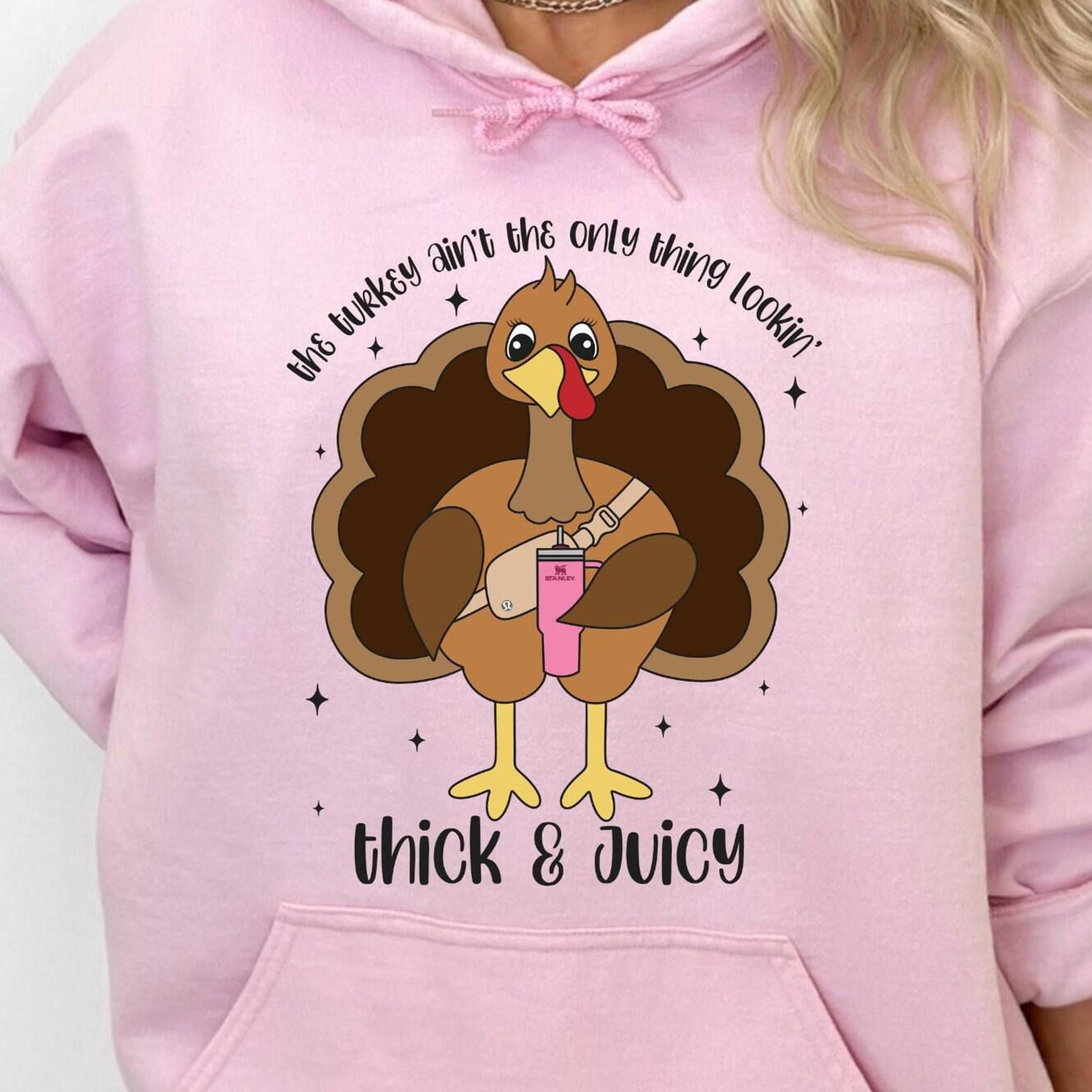 bring bold humor to turkey day with this the turkey ain't the only thing lookin thick and juicy sweatshirt, made for any
