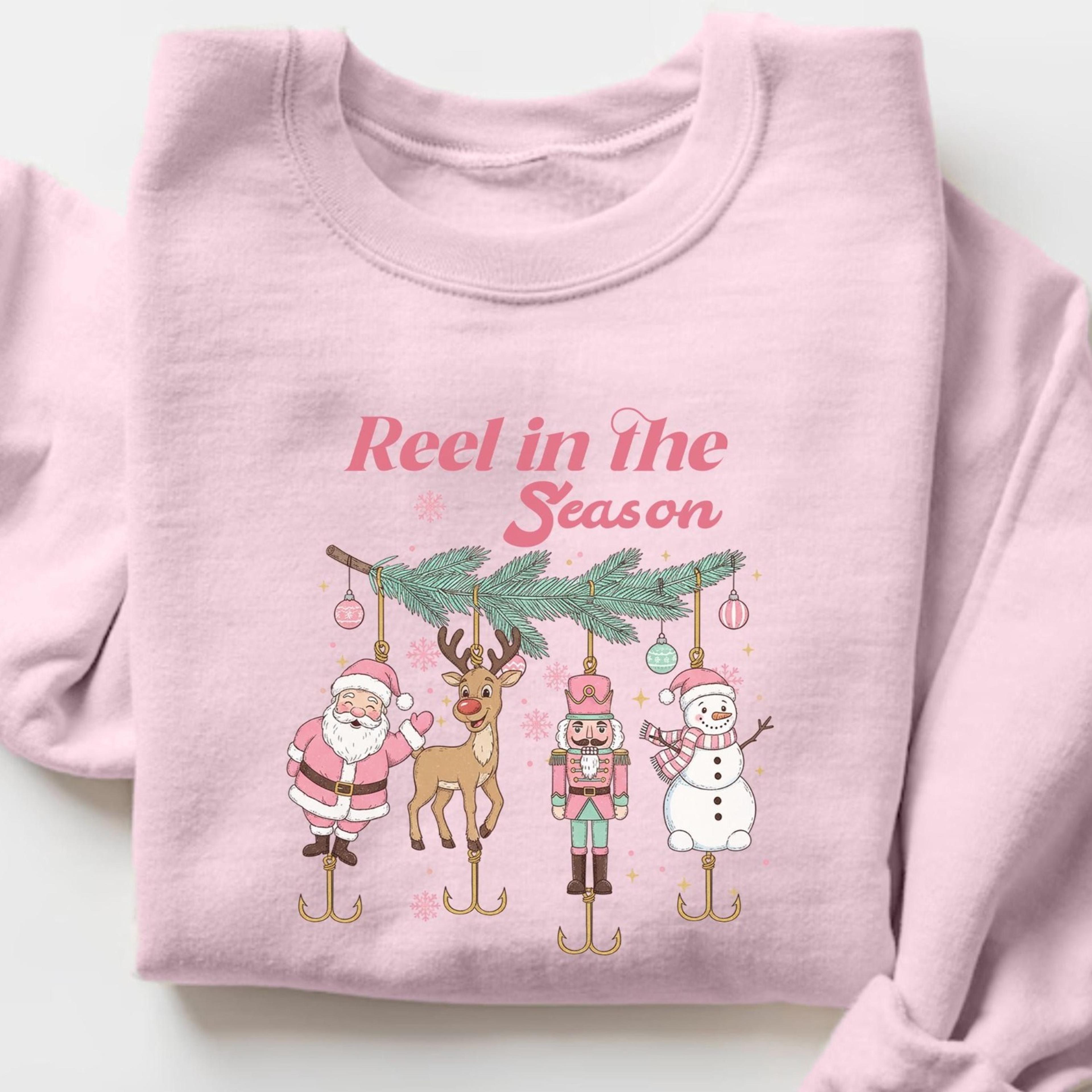 reel in the season christmas sweatshirt, funny fishing holiday shirt, santa reindeer fisherman crewneck, xmas gift