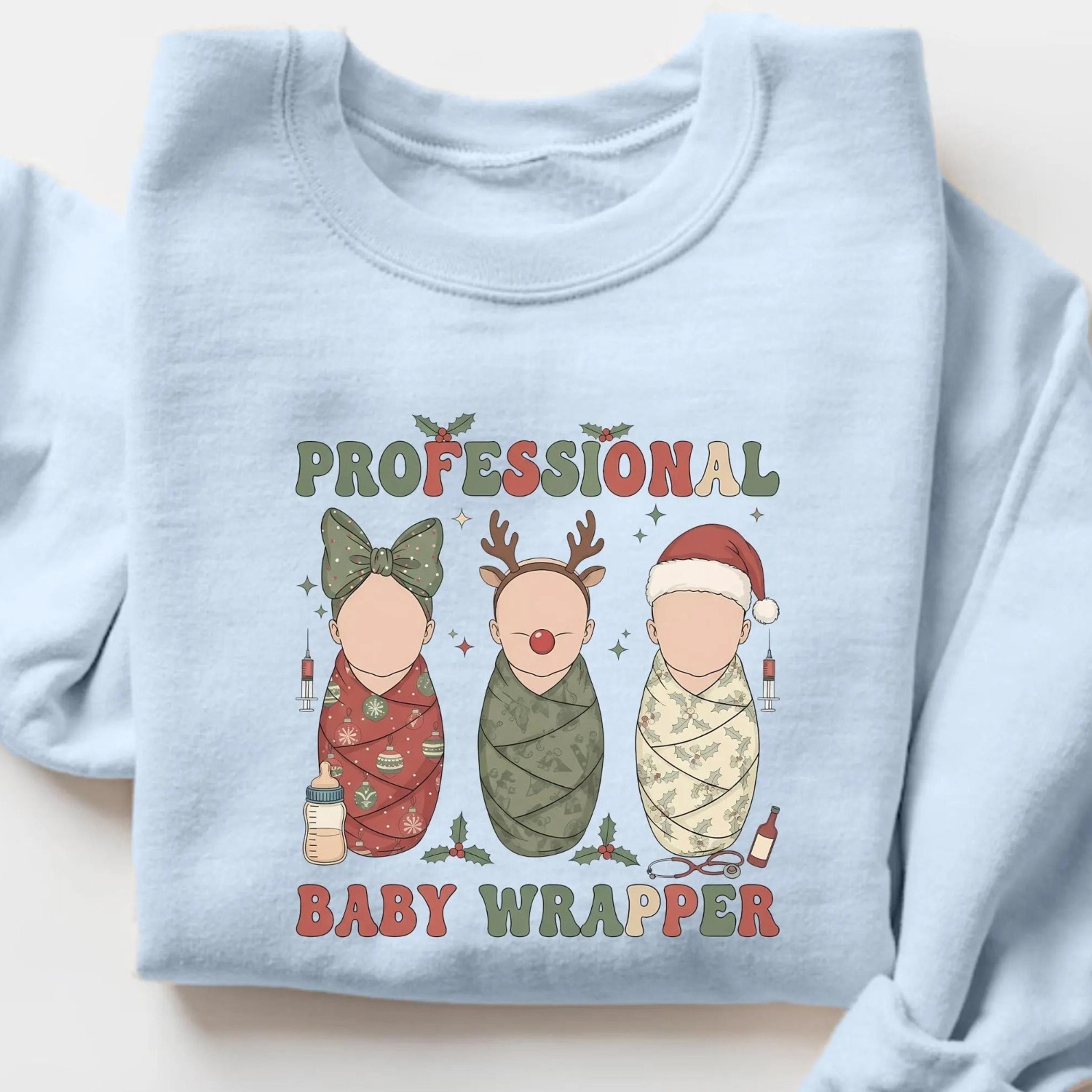 labor and delivery christmas sweatshirt, professional baby wrapper l&d nurse christmas t-shirt, labor nurse gifts