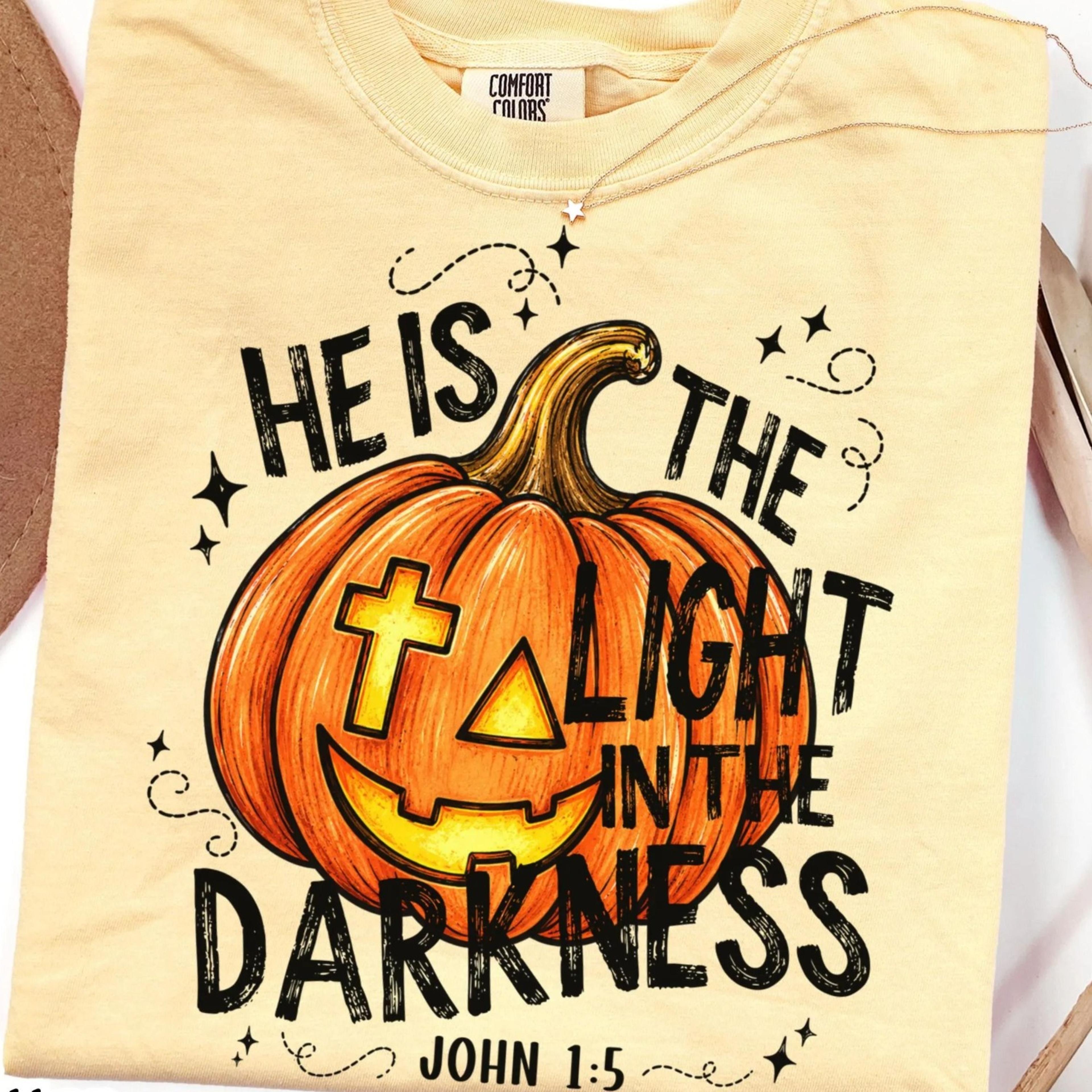 halloween shirt he is the light in the darkness tee john 1 5 faith pumpkin fall jesus tshirt bible verse t-shirt
