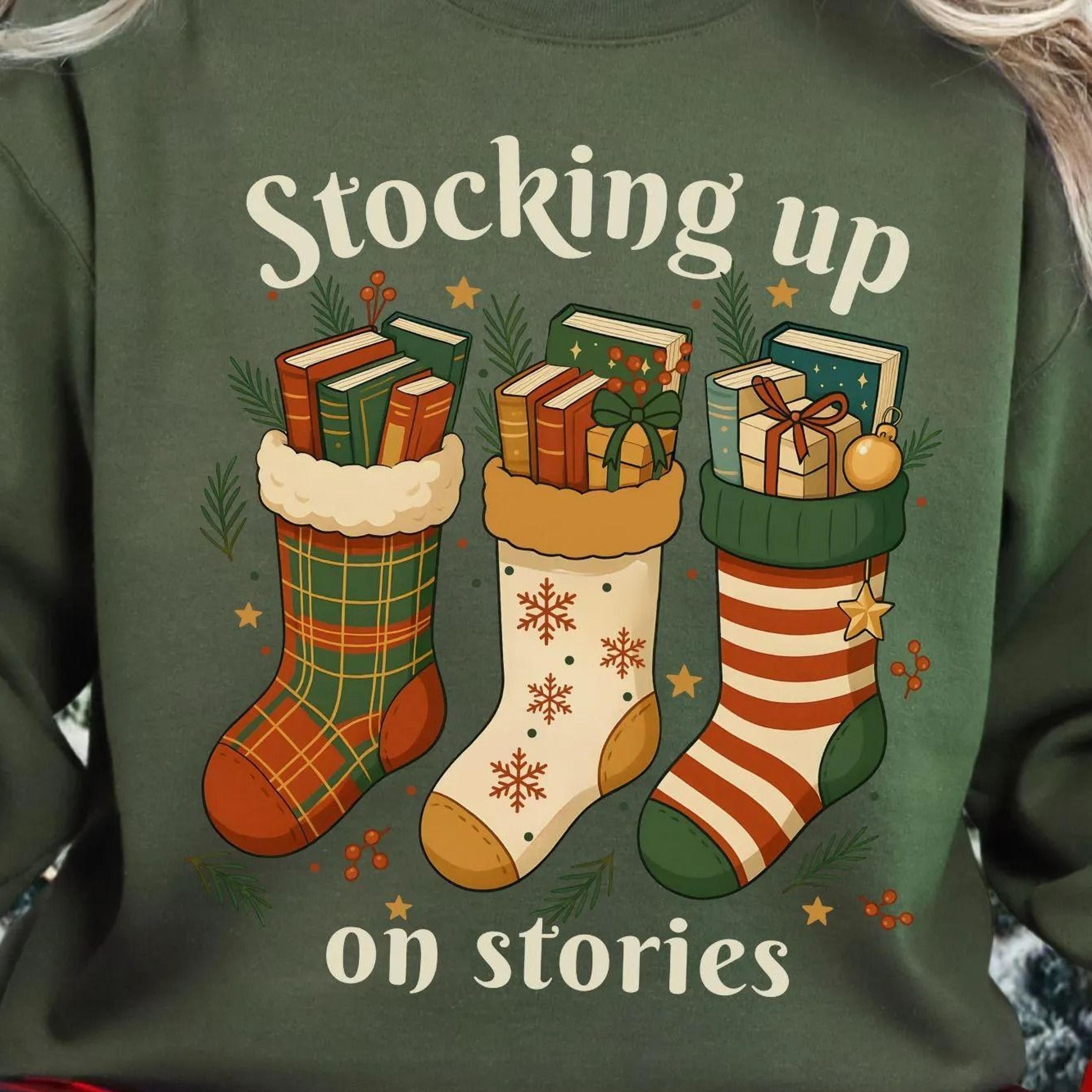 christmas bookish sweatshirt stocking up on stories shirt cozy reader holiday book lover sweater festive reading
