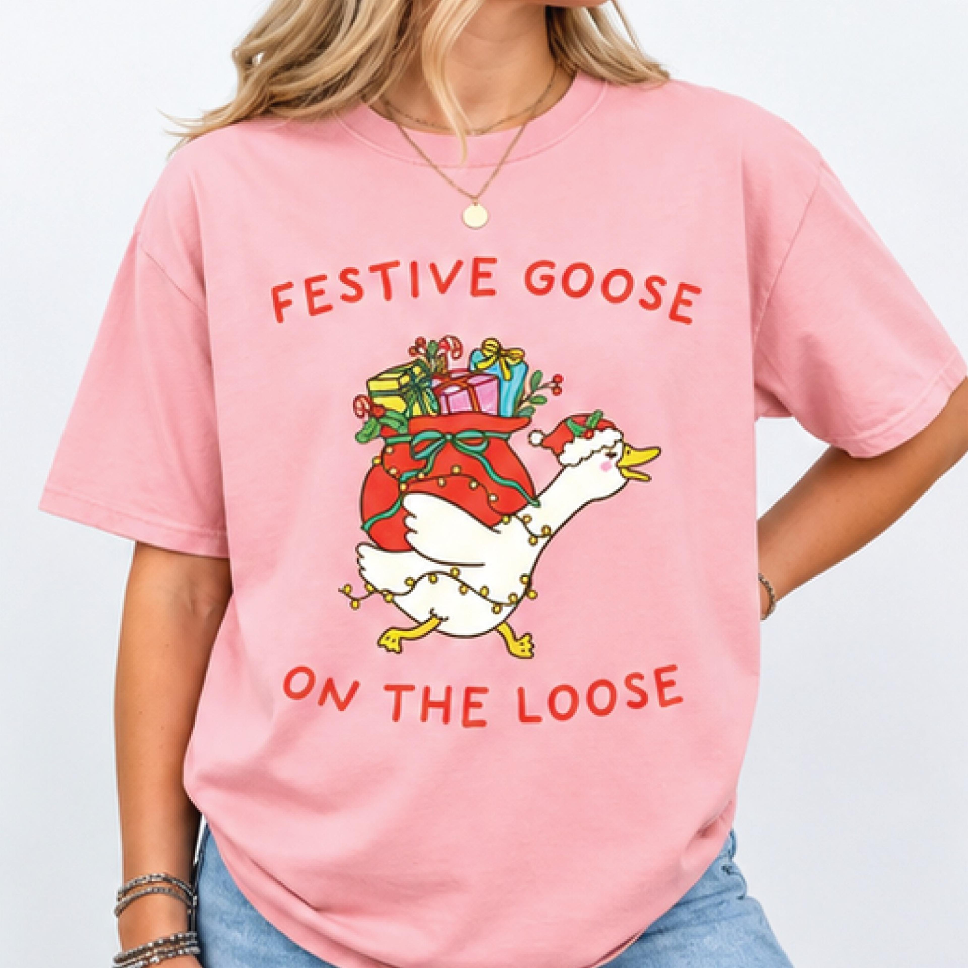 festive goose on the loose christmas shirt, funny holiday goose graphic tee, cute santa goose xmas gift, christmas party