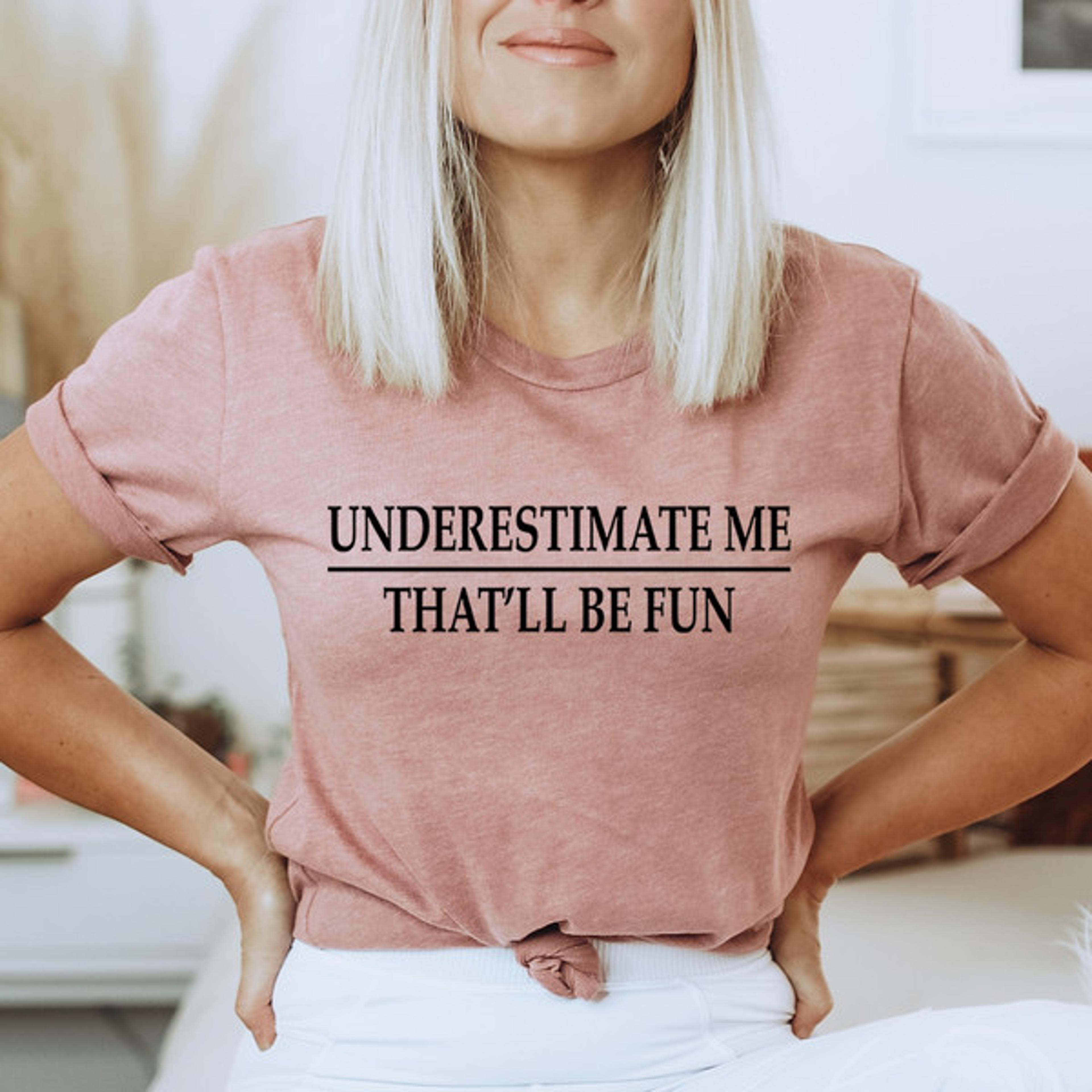 underestimate me tee