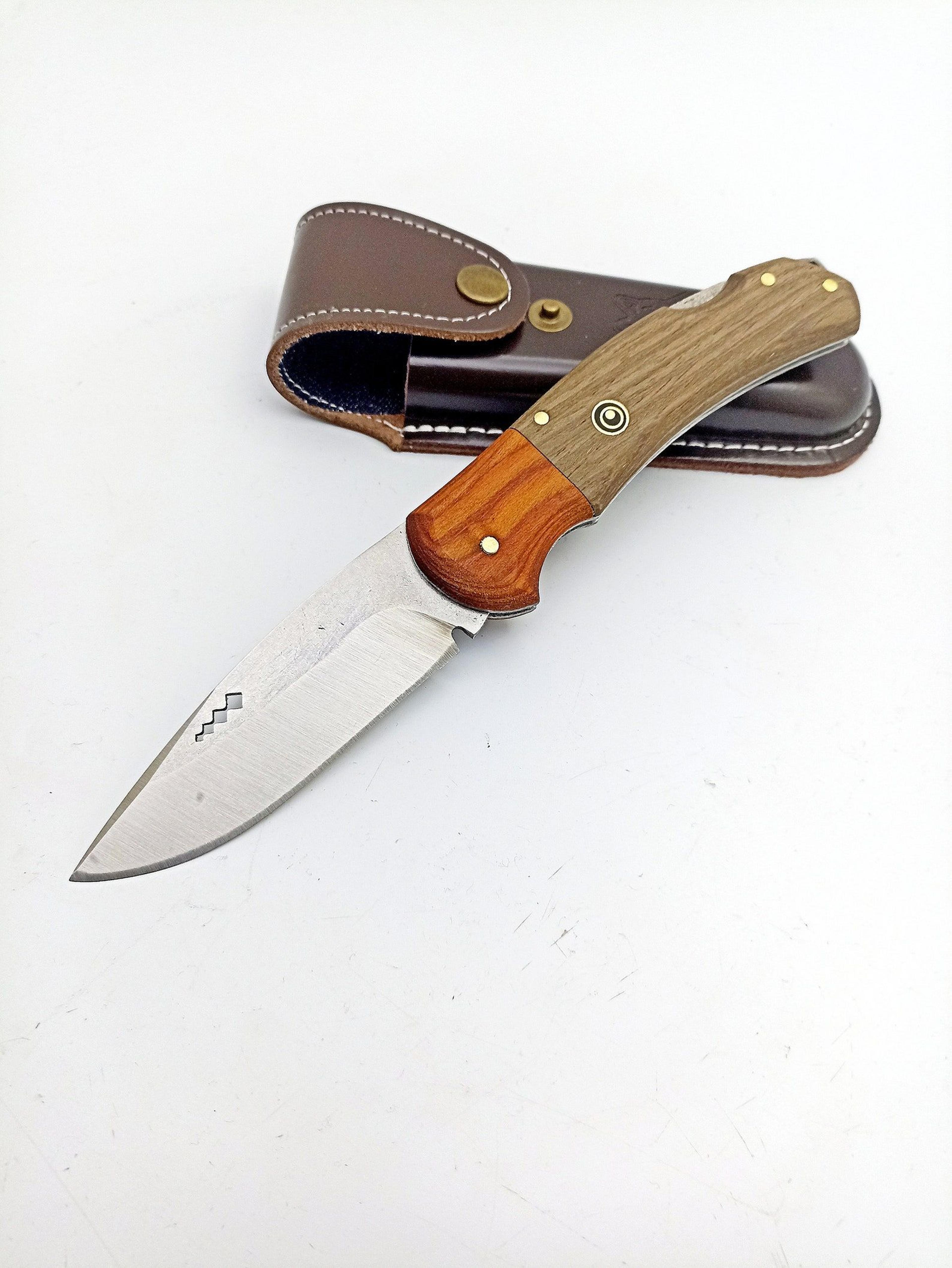 unique handmade folding knife with custom engraving and leather sheath for outdoor enthusiasts