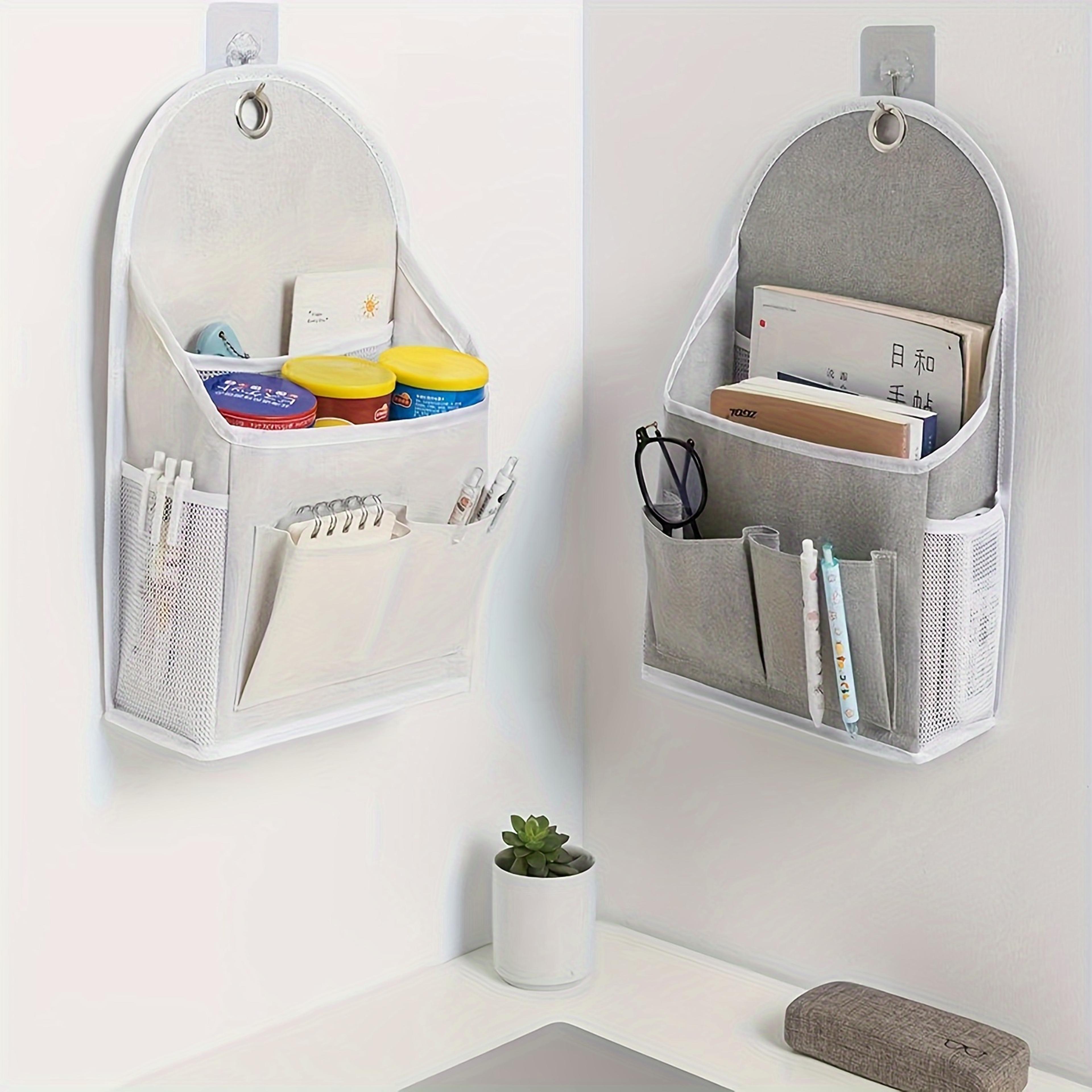 multi-purpose hanging storage bag with dual pockets and mesh side compartments, wall mounted storage solution