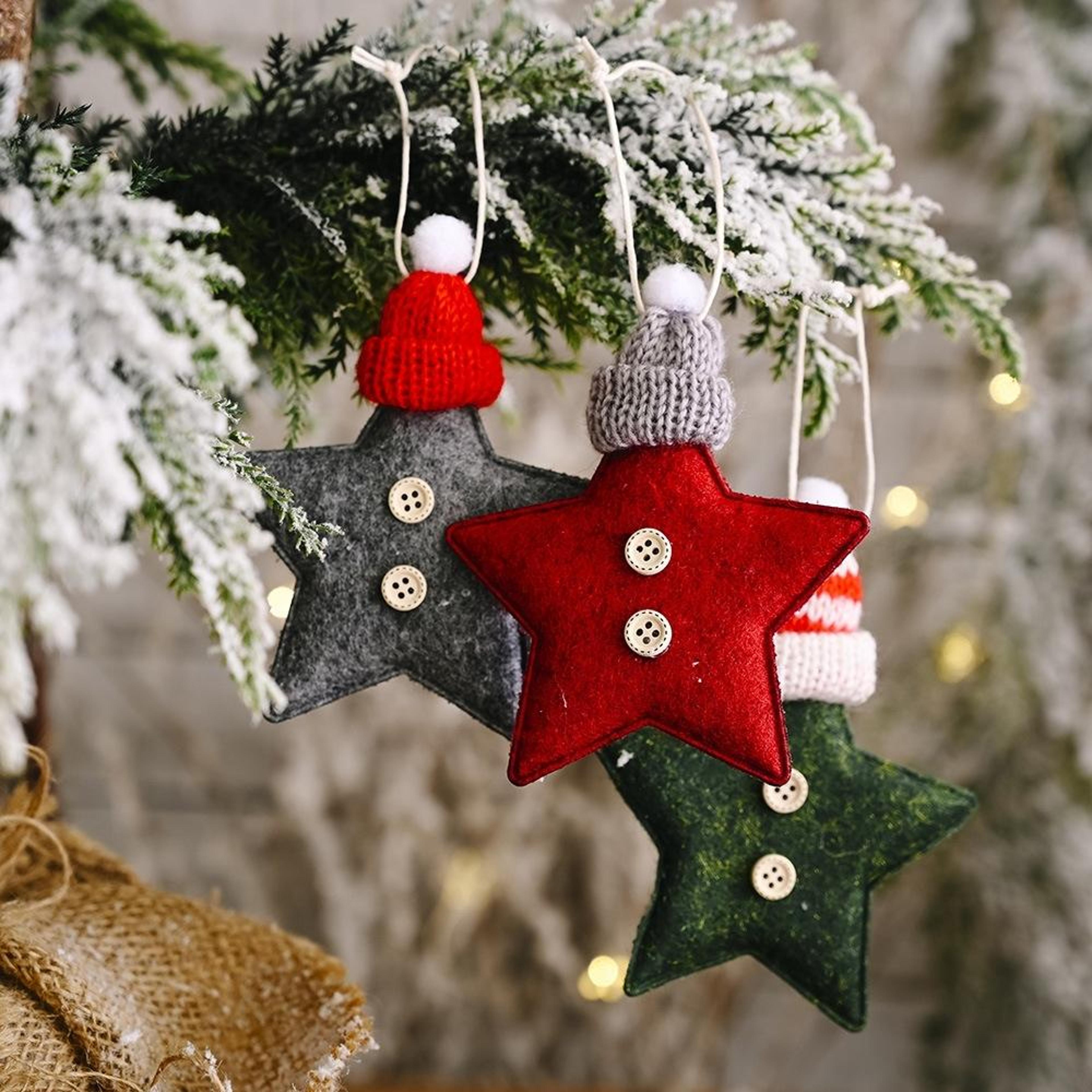 knitted star christmas tree ornament with festive hat hanging decoration