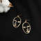 Zinc Alloy Wire Face Earrings