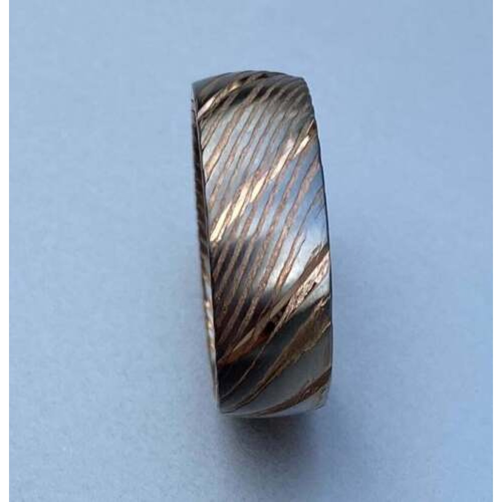 Dazzling_Damascus_Steel_Wedding_Ring_Set_with_Wood_Case_–_Perfect_Bands_for_Men_and_Women (1).jpg