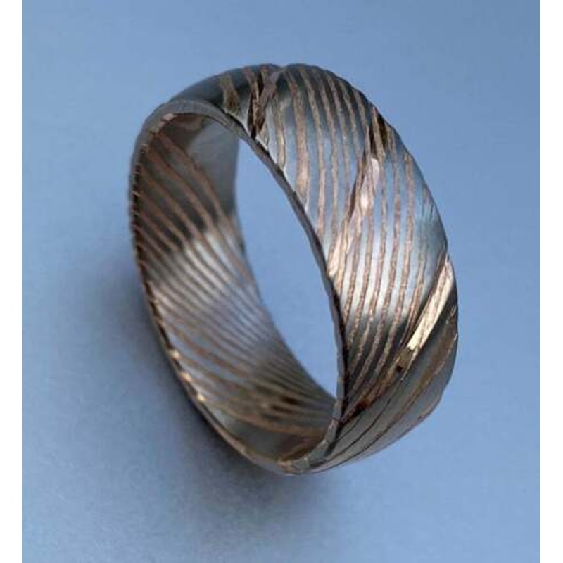 Dazzling_Damascus_Steel_Wedding_Ring_Set_with_Wood_Case_–_Perfect_Bands_for_Men_and_Women (3).jpg