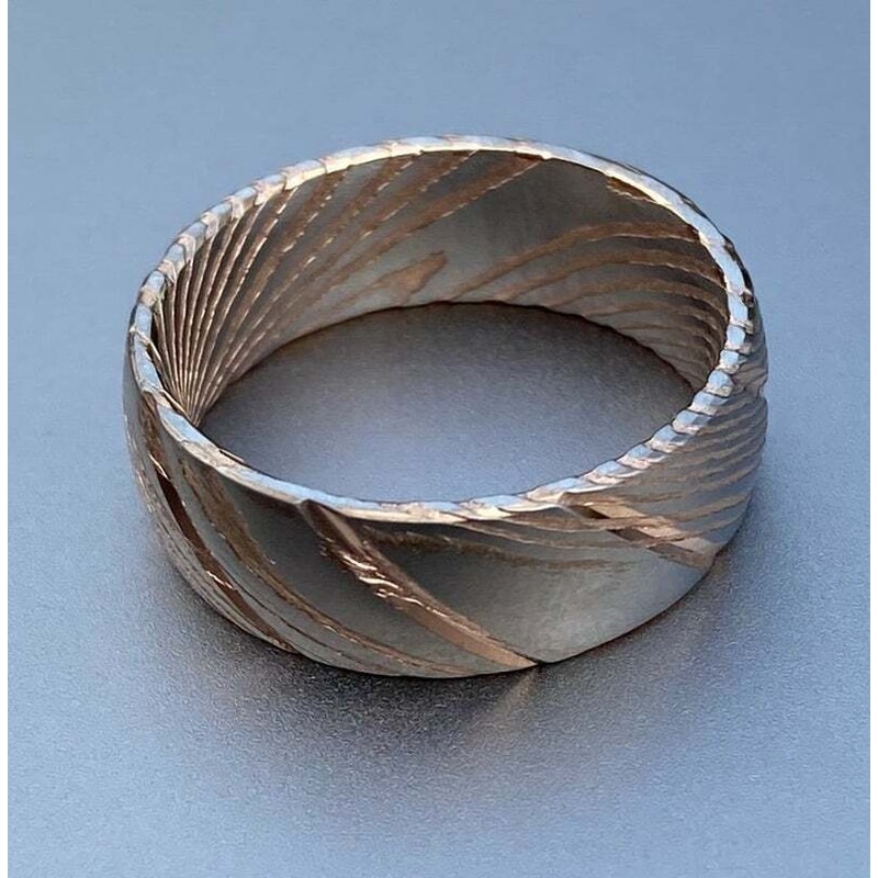 Dazzling_Damascus_Steel_Wedding_Ring_Set_with_Wood_Case_–_Perfect_Bands_for_Men_and_Women (4).jpg