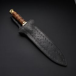 d2 tool steel, sculptured rose wood with red fiber spacers, brass pommel and clip scale