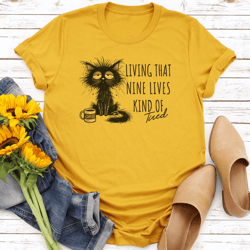living that nine lives kind tired tee