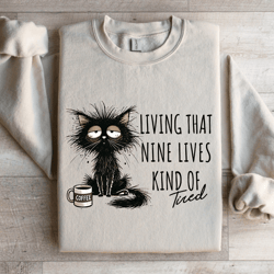living that nine lives kind of tired sweatshirt