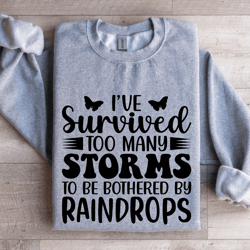 i've survived too many storms to be bothered by raindrop sweatshirt