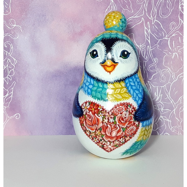 A cute penguin with a heart of roses  Rolly polly toy , Musical toy (2).jpg