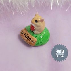 hamster memorial statue on the basement with custom name Golden and white color