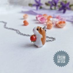 Guinea pig figurine necklace with strawberry