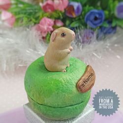 figurine of a guinea pig with an urn for ashes