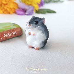 a gray hamster small statue