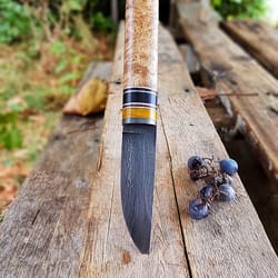 premium blacksmith forged puukko knife in damascus steel with natural wood handle