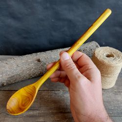 Handmade wooden spoon from natural scumpia wood with long handle for stirring cocktail or ice cream or milkshake spoon