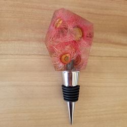 Handmade resin wine bottle stopper with embedded dried pink Australian flowering gum flowers