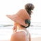 Summer beach hat with wide brim and bow