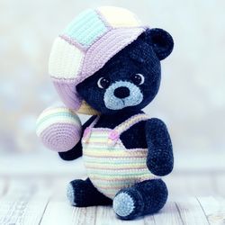 Blue teddy bear in a cap. Soft toy for a child as a gift. Teddy bear handmade. Crocheted gray teddy bear.