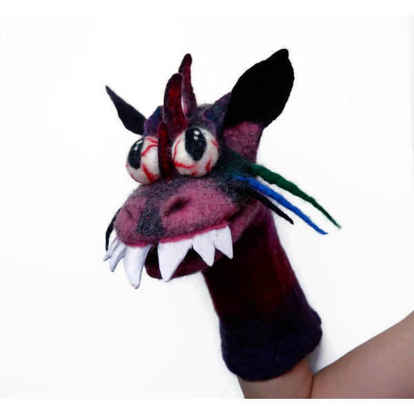 Dragon puppet toy on hand